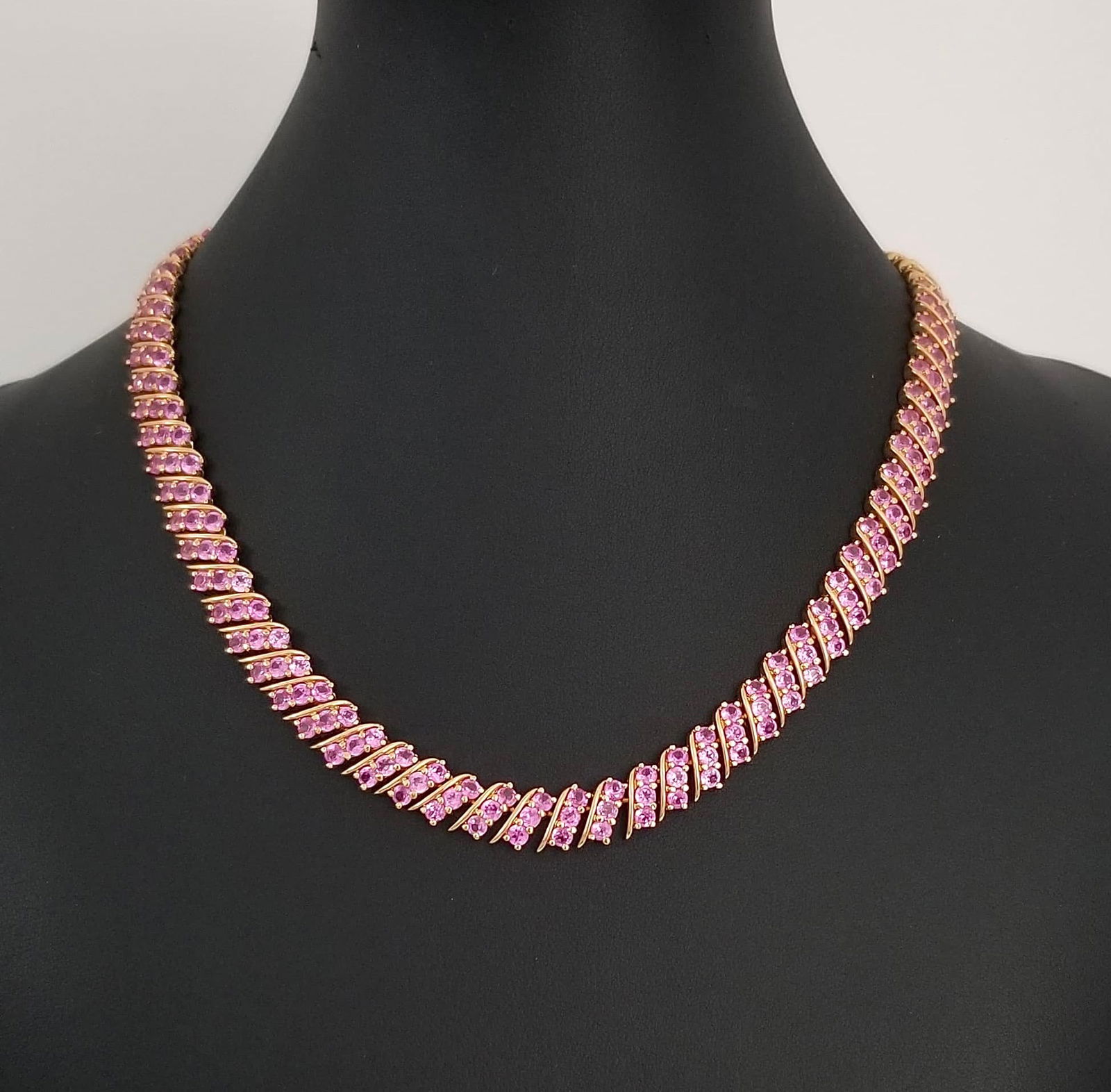 Amazing 925 Sterling Golden Pink ZC Faceted Necklace: Beautiful 925 sterling silver golden pink Zirconia faceted tennis necklace, 17 x 3/8 inches, 52.6 grams.