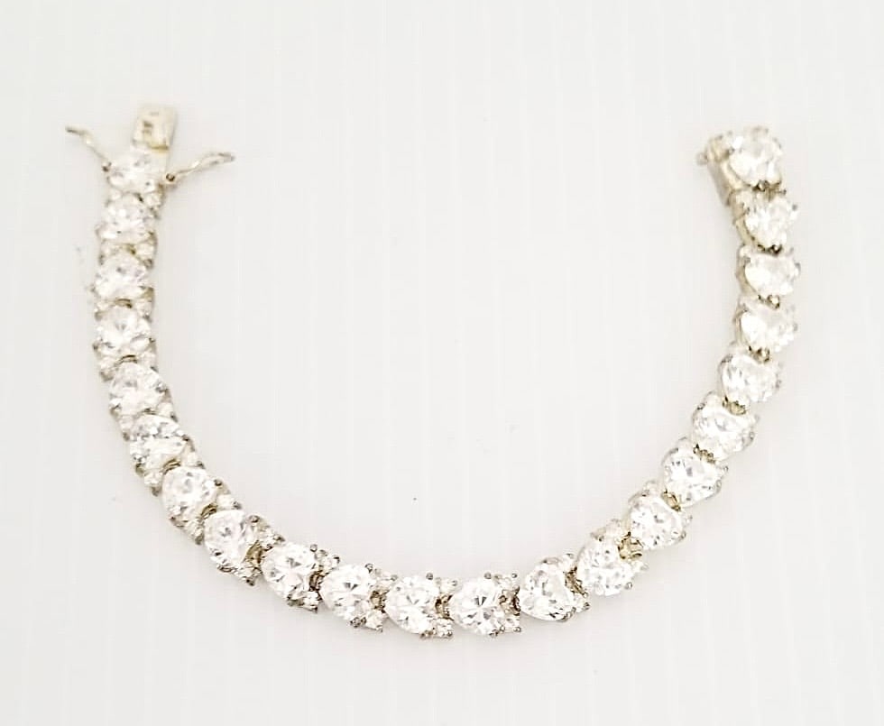 Amazing 925 Sterling Faceted Clear Zirconia Hearts Bracelet: Nice 925 sterling silver faceted clear Zirconia hearts bracelet, 7 x 3/8 inches, 24.5 grams.