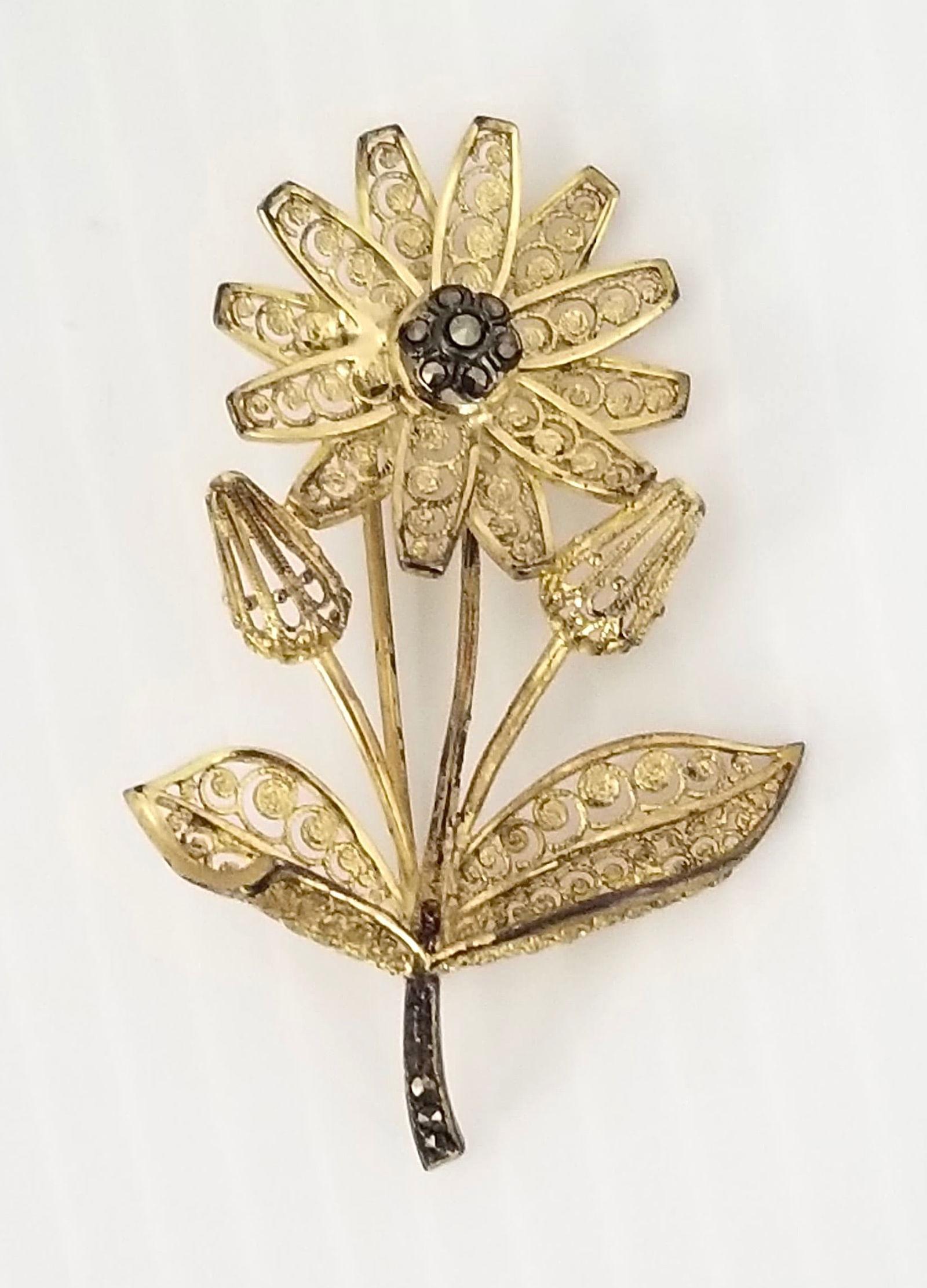 Amazing Daviness Sterling Gold Tone Flower Pin Brooch: Beautiful sterling gold tone flower pin brooch, Daviness, Germany, signed, marcasite flower, 2 1/8 x 1 3/8 inches, 6.4 grams. There is some color loss for years created.
