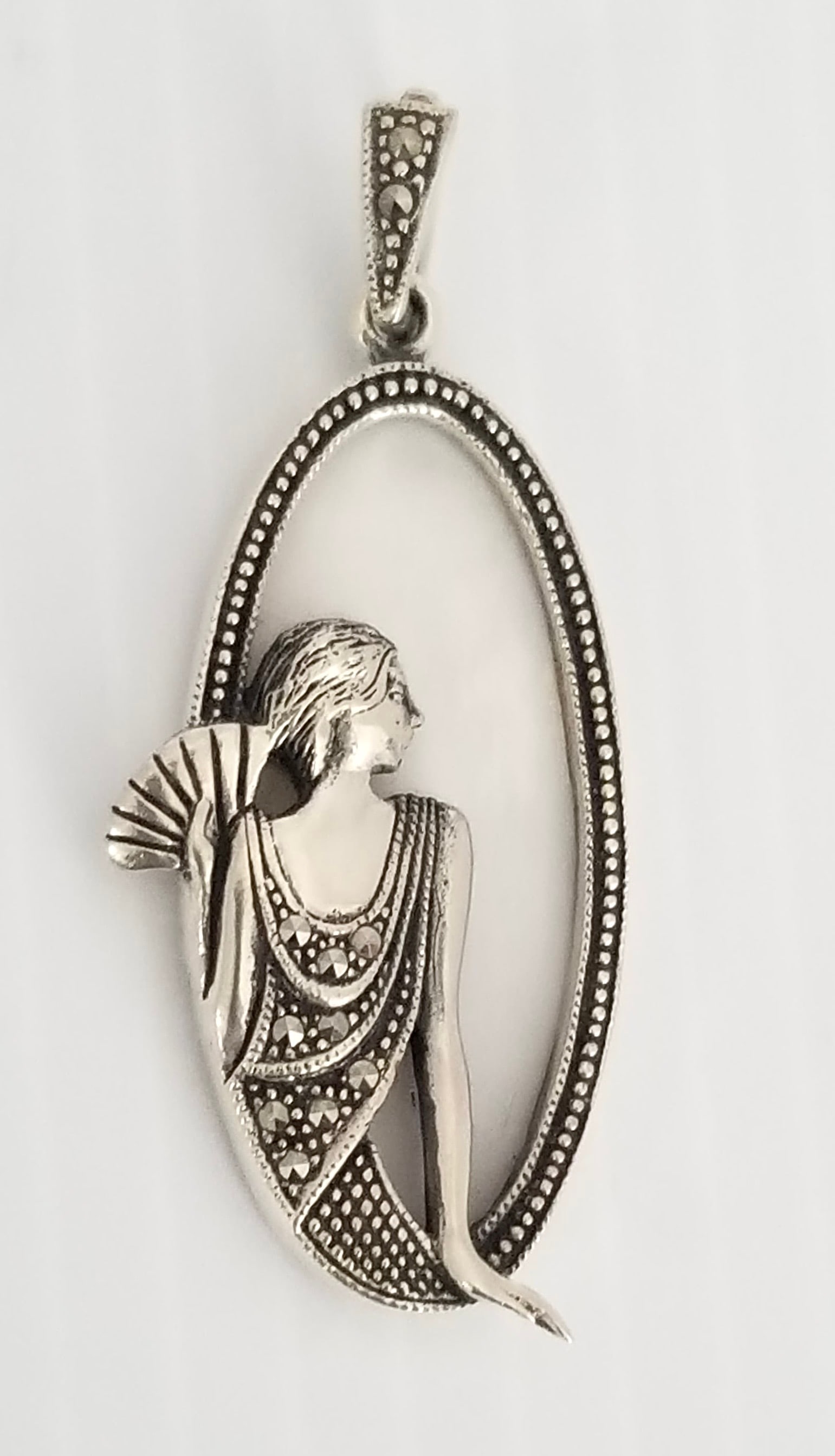 Amazing Art Deco Sterling Mother of Pearl Marcasite Pendant: Beautiful art deco sterling silver mother of pearl and marcasite lady pendant, 2 1/8 x 1 inches, 9.2 grams.
