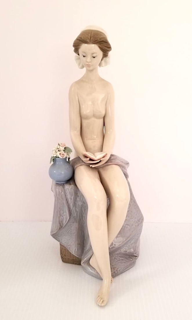 Amazing Lladro Model Porcelain Figurine: Beautiful Lladro model with flower vase porcelain figurine, #5417, 12 5/8 x 6 x 5 inches.
