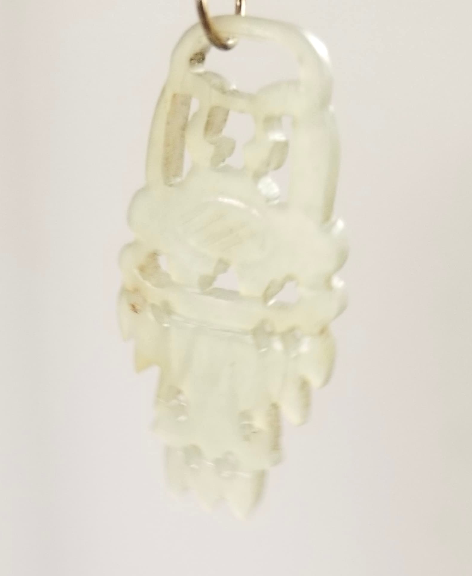 Amazing Sterling Silver Translucent Hand Carved Jade Pendant: Beautiful stering silver translucent hand carved green Jade pendant, 1 3/4 x 3/4 inches approx.
