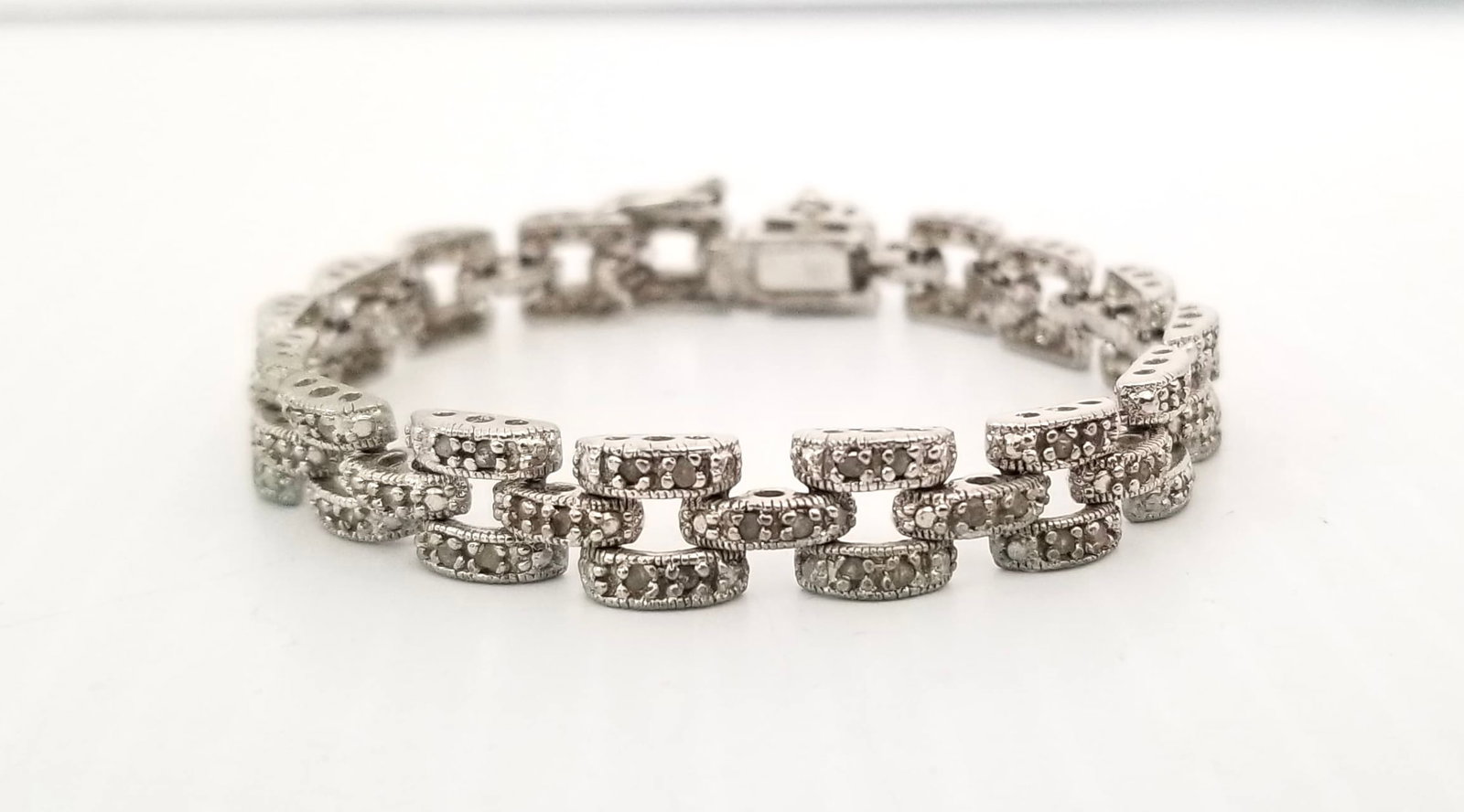 Amazing DBJ 925 Sterling Silver Diamond Bracelet: Beautiful DBJ 925 sterling silver diamond bracelet, 7 1/2 inches x 8mm, 16.6 grams, it has some little scratches on the closure.