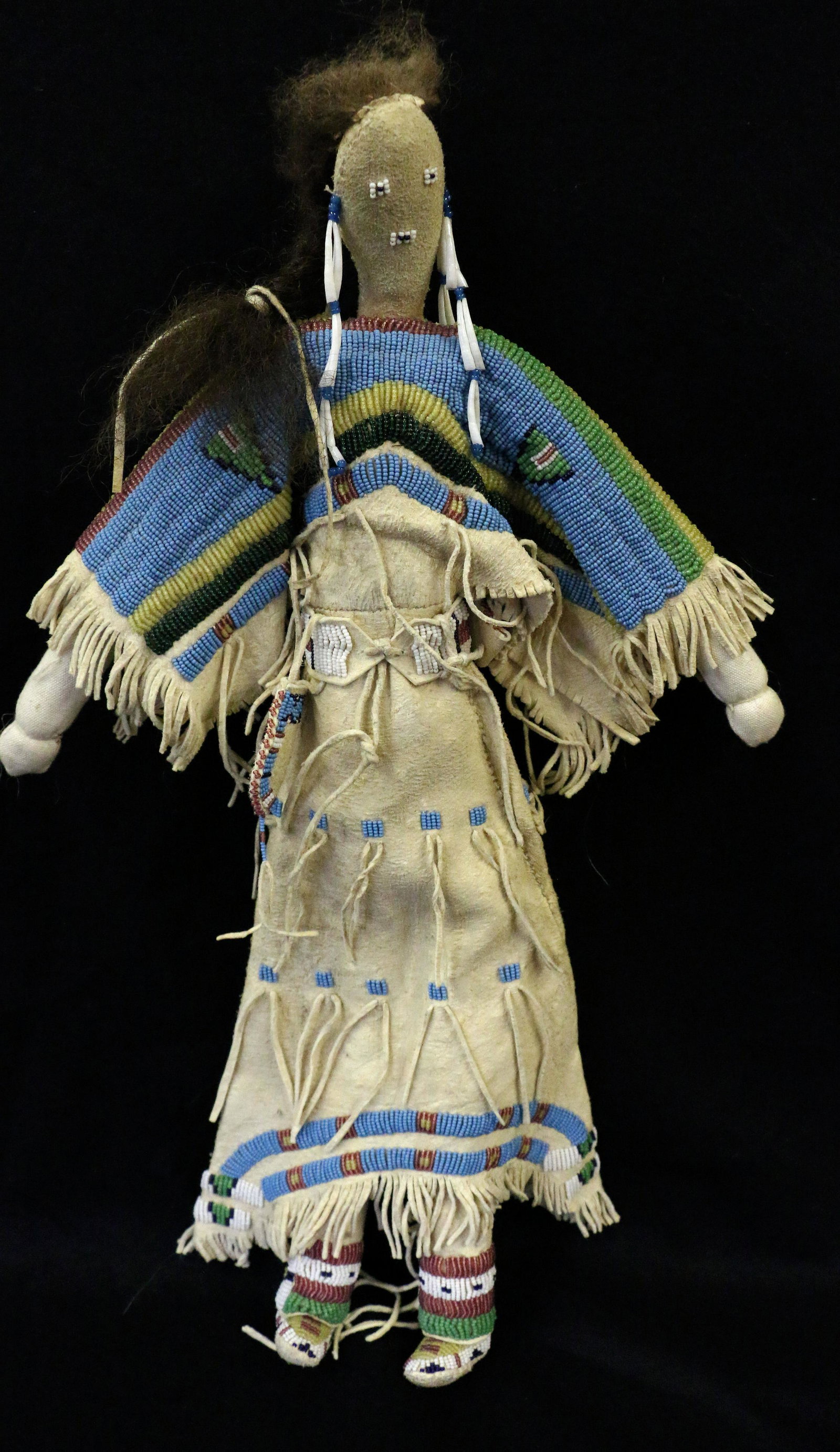 Plains Beaded Doll: Plains Indian Beaded Doll, possibly Sioux, 20" tall, sinew-sewn.
