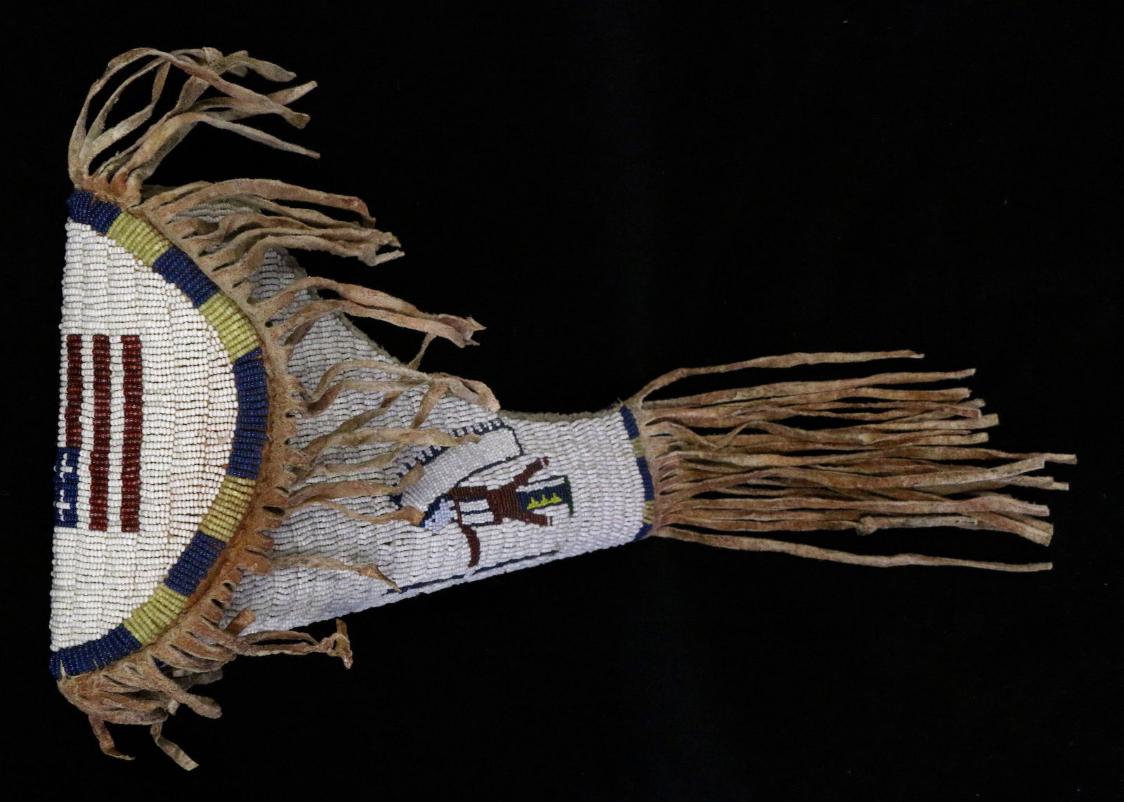 Beaded Plains Pistol Sheath: Beaded Plains Pistol Sheath with American Flag and Indian with Feathered Bonnet Motif, 21.25" long, sinew-sewn.