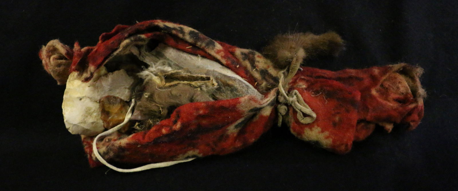 Plains Indian Medicine Man Bundle: Plains Indian Medicine Man Fetish Bundle, trade cloth, flints, small trade pipe, 14.5" long, leather ties.