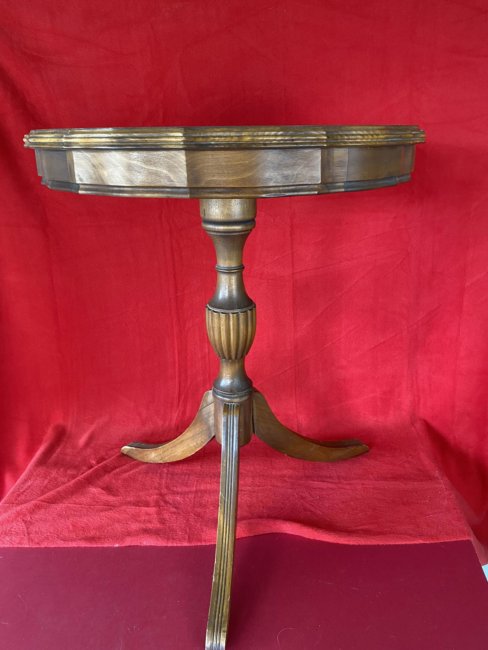 Vintage Three Leg Pedestal Table: Vintage Mahogany Three Leg Pedestal Table, with Duncan Phyfe style legs and scalloped table-top, one leg has 2 repairs 26" tall.