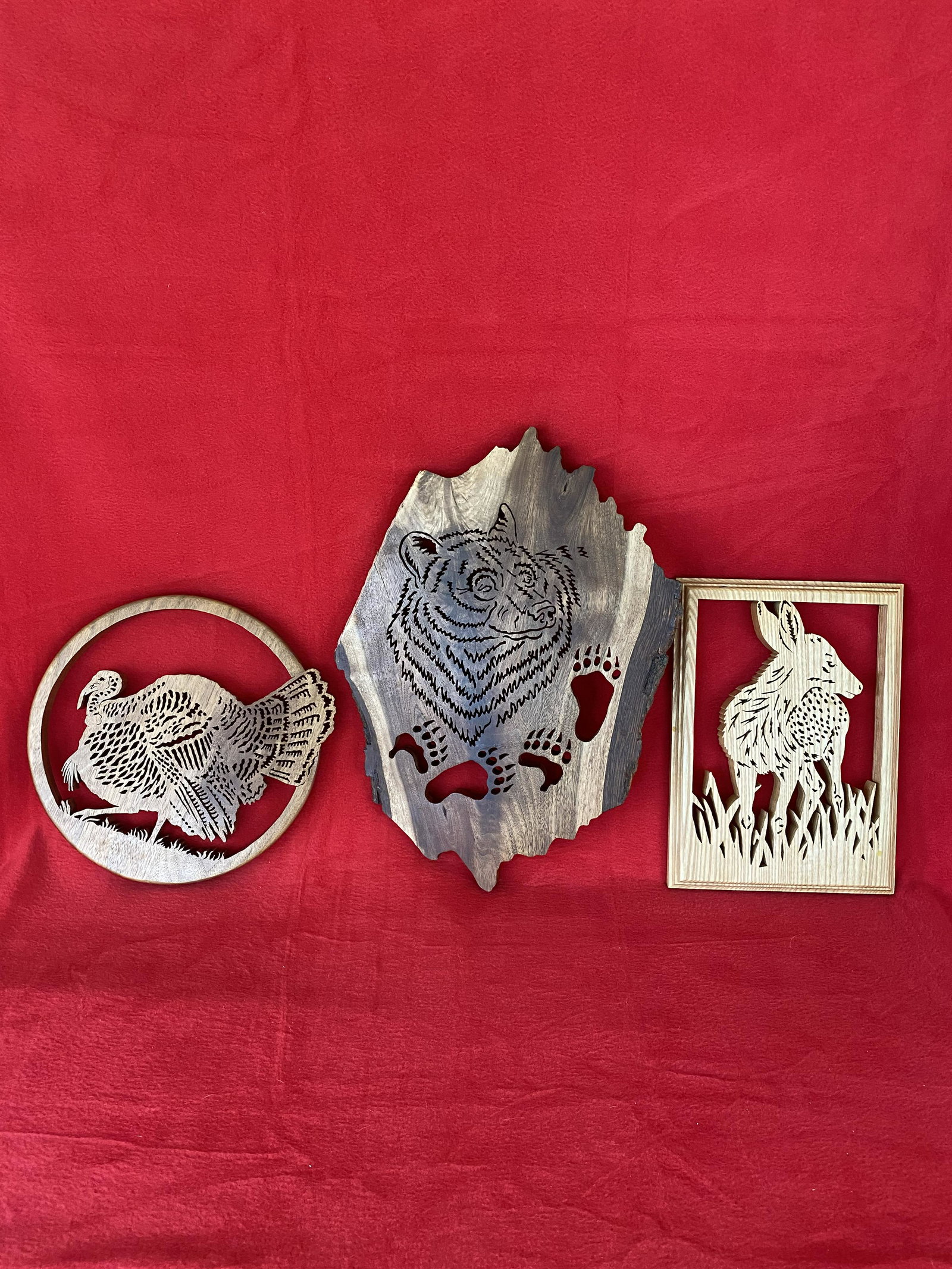 Lot:3 Wood Carvings of Figural Wildlife Trivets: Lot:3 Wood Carvings of Figural Wildlife Trivets : a Bear ; a Fawn and a Turkey, all 3 signed Adair and dated, 16"x11.5" (Bear) , 11"x8" (Fawn) and 10" diam. Turkey.