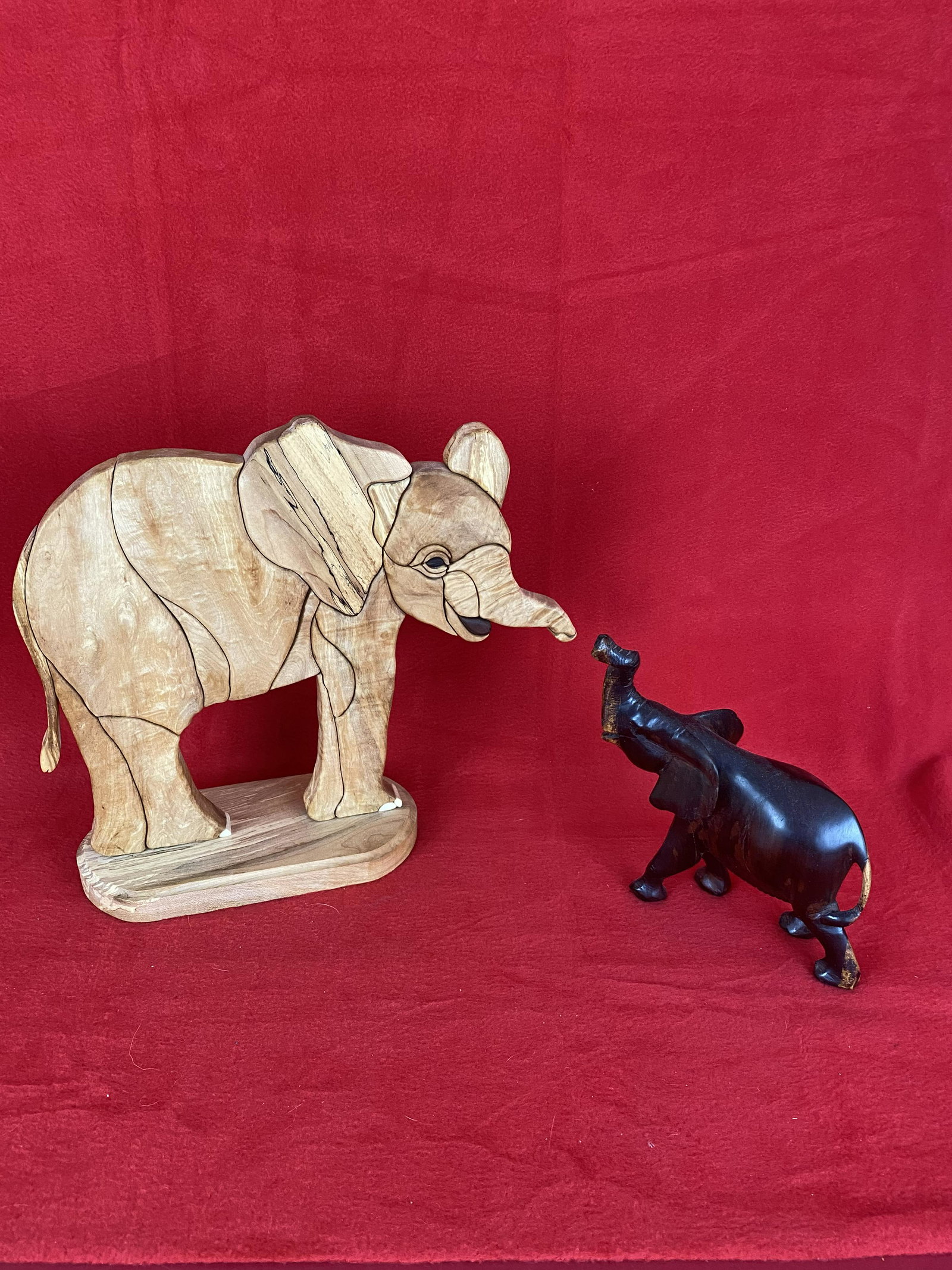 2 Wood Carvings - Elephant by R. Adair and Another: 2 Wood Carvings - Elephant by R. Adair which stands approx. 11 tall and another separate Rosewood Elephant which stands approx. 7.25" tall, both Excellent Condition.