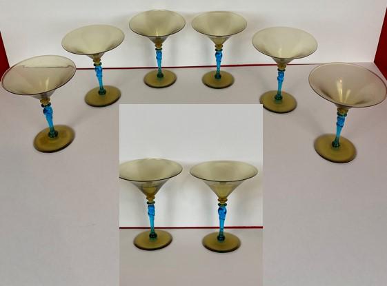 Set of 6 marked Steuben Champagne Glasses: Set of 6 marked Steuben Champagne Glasses, with blue and amber glass, stand approx. 5.5" tall and 4.5" dia. Top rims.