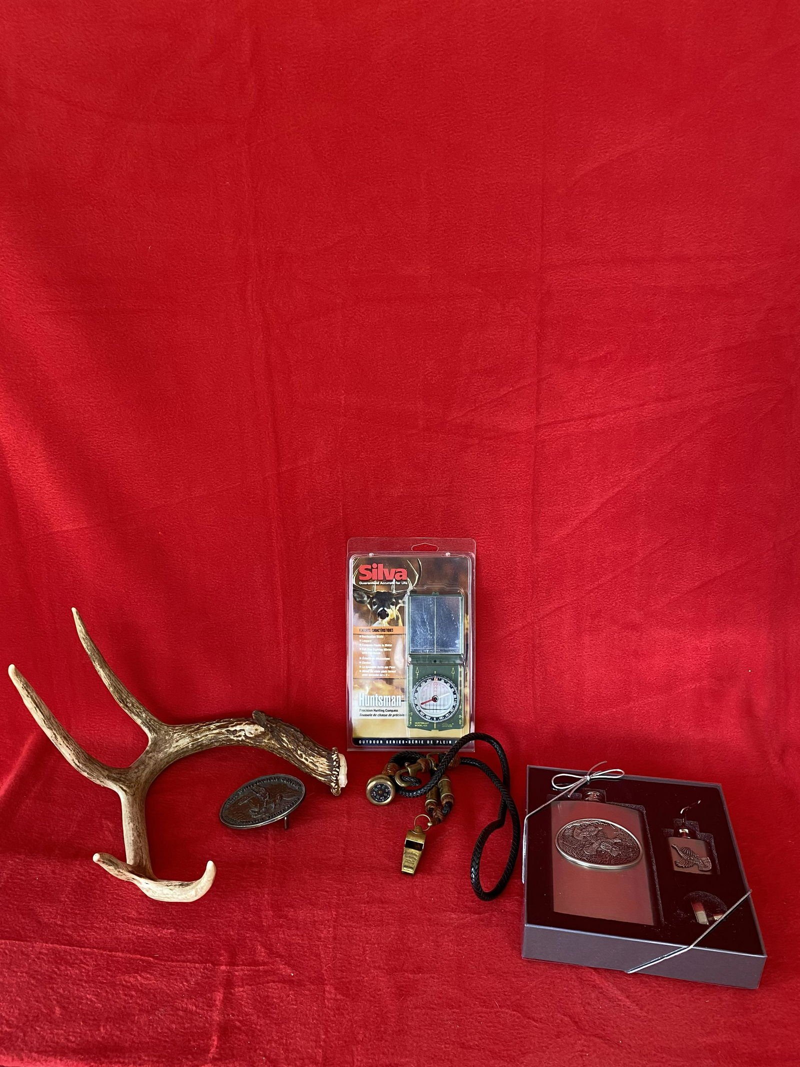 Misc. Sportsman's Lot: Misc. Sportsman's Lot: A deer Antler ; Ruffed Grouse Hip Flask gift set; Silva Compass in original package, The ACME Thundered Whistle with braided rawhide lanyard and a Whittington Custom Belt Buckle