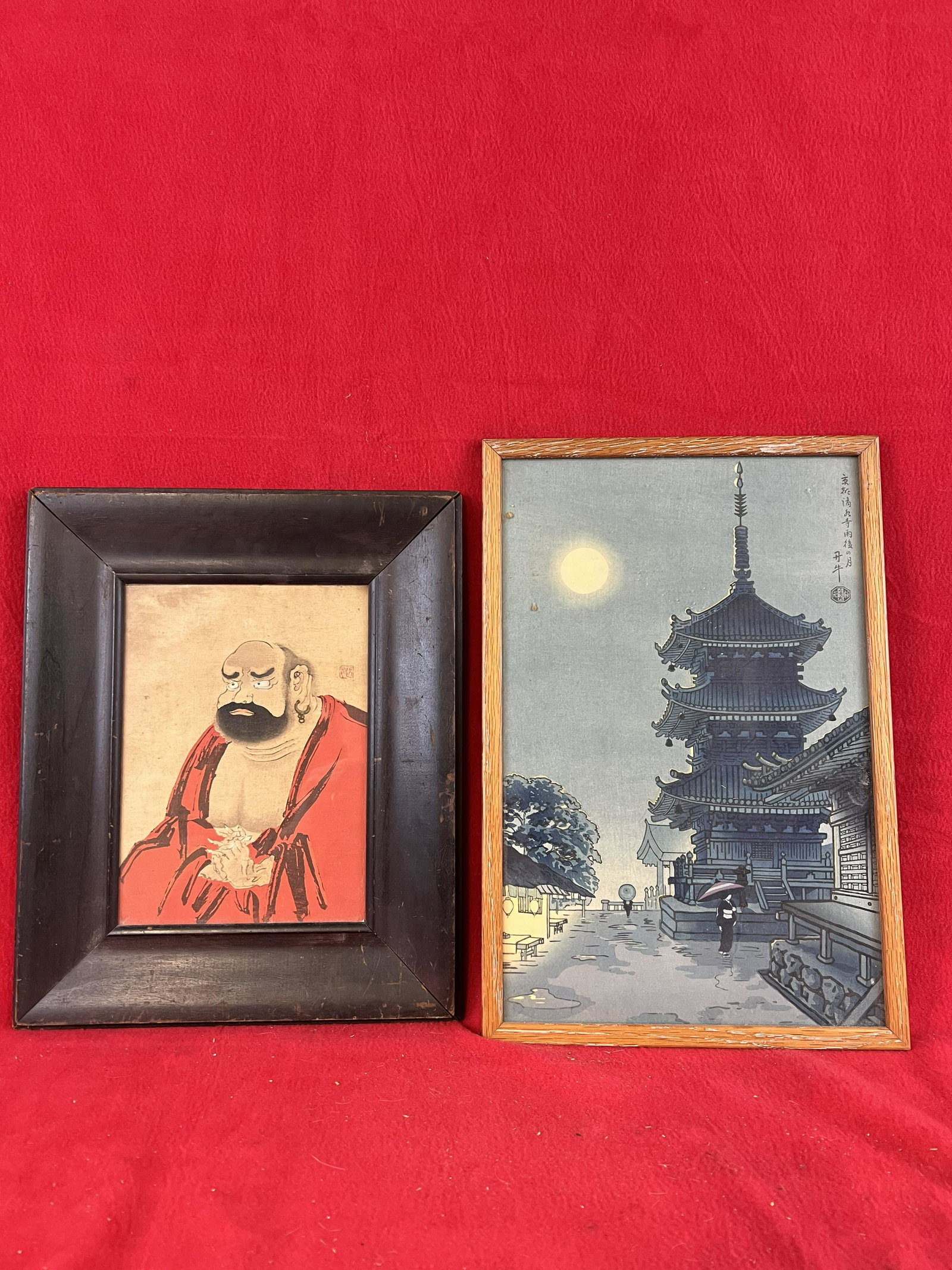 Lot of Two Framed Japanese Woodblock Prints: Lot of Two Framed Japanese Woodblock Prints one being of a man the other showing a pagoda shaped temple building. Both are signed within the print. The framed print of the man measures approximately 1