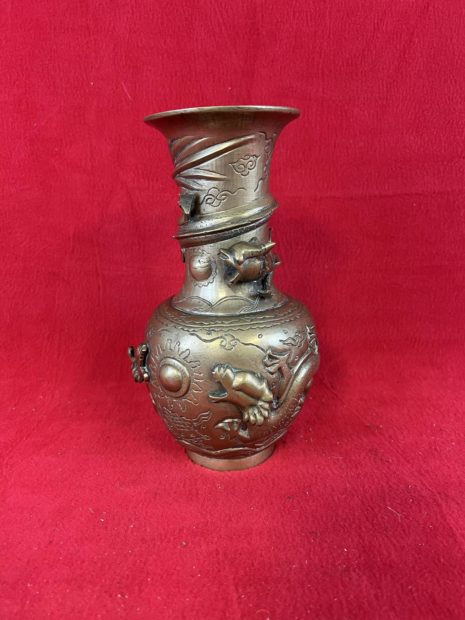 Vintage Asian Bronze or Brass Vase: Vintage Asian Bronze or Brass Vase which stands approximately 9" tall and is decorated with dragons. Vase has been polished as shown.