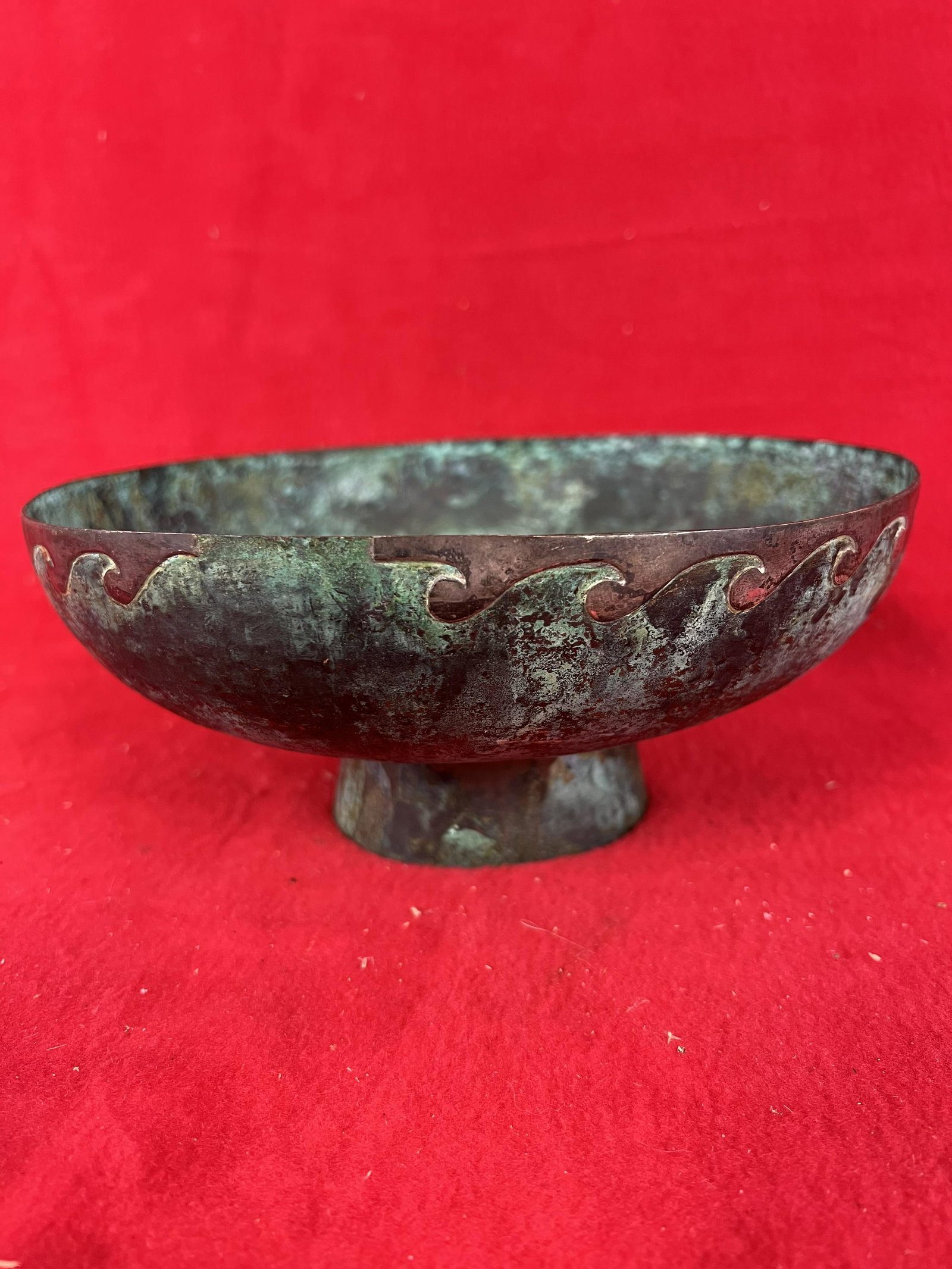 Peruvian Sterling Silver Overlay on Bronze Pedestaled: Peruvian Sterling Silver Overlay on Bronze Pedestaled Bowl which measures approximately 3 3/4" tall and having a diameter of 9". The human figure at center is marked Peru and .925. Condition - is as s
