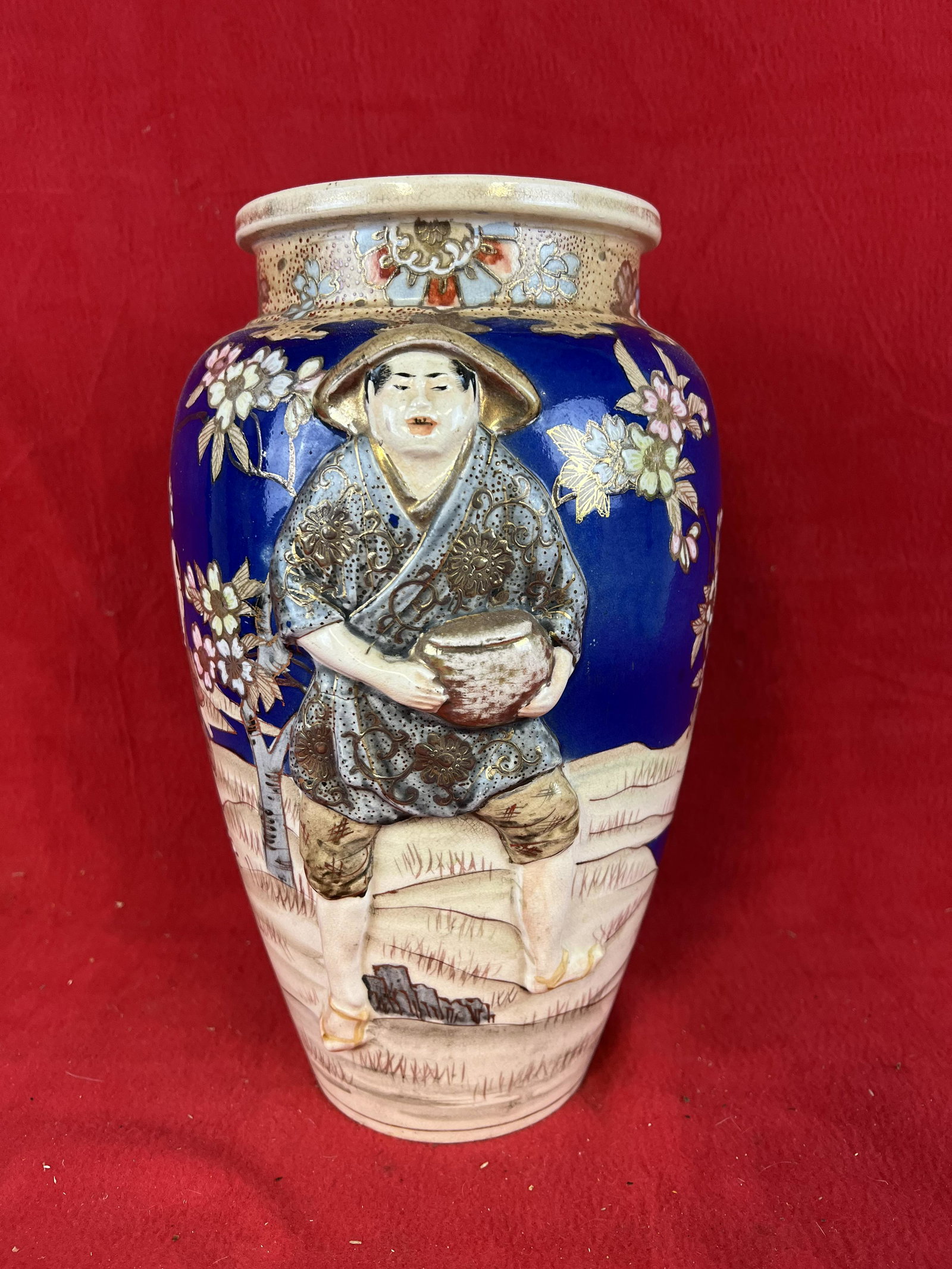 Vintage Satsuma Pottery Vase: Vintage Satsuma Pottery Vase with highly embossed figure. Vase stands approximately 13" tall and aside from some minor wear to the gold highlighting is in fine condition.