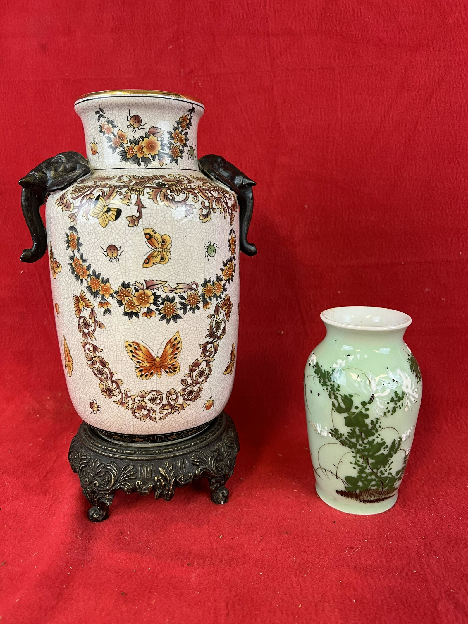 Lot of Two Asian Decorative Vases: Lot of Two Asian Decorative Vases one of porcelain with a light green glaze which stands approximately 6" tall the other of pottery with crackle glaze decorated with transfers of insects etc. and havi
