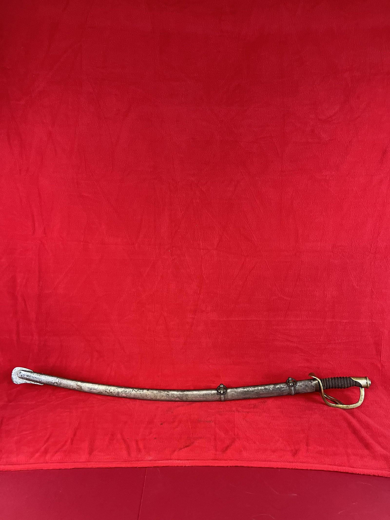 Model 1860 Civil War Cavalry Sword: Model 1860 Civil War Cavalry Sword with brass hilt and having a iron scabbard. Blade measures approximately 34 1/2" long and is marked by the maker Ames Manufacturing Company Chicopee Mass. As well as