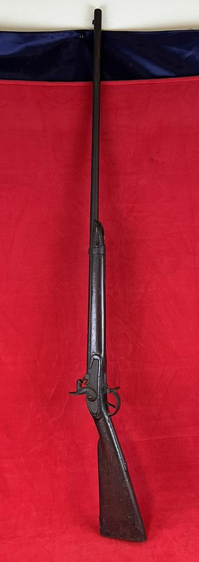 Antique Percussion Rifle: Antique Percussion Rifle which appears to be unmarked as far as manufacturer. Rifle measures approximately 53" long with a walnut stock. Condition - general wear and browning on metal as shown. Trigge