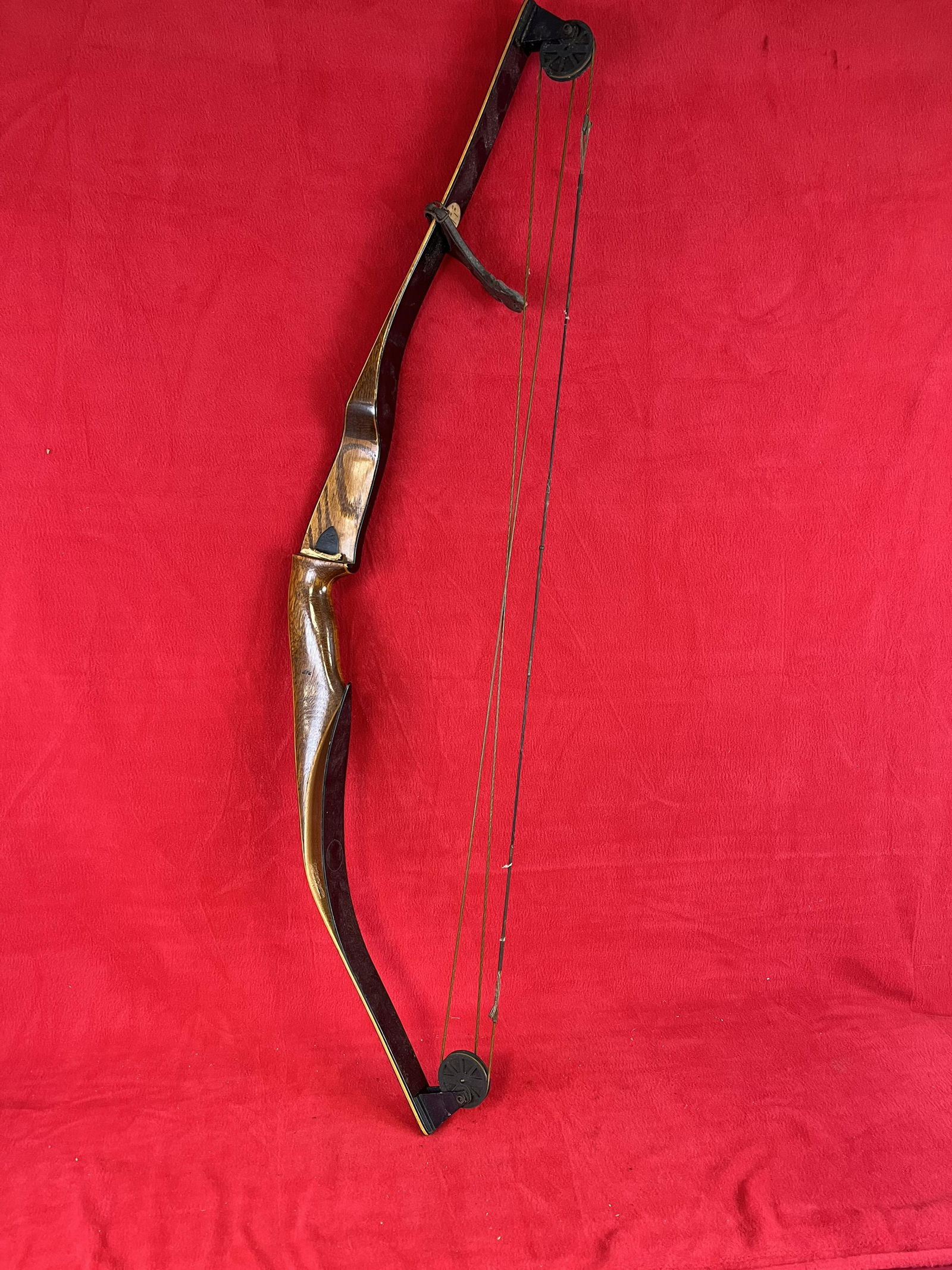 Black Hawk Compound Bow: Black Hawk Compound Bow which measures approximately 44 1/2" from tip to tip. Condition - the interior laminate needs to be reglued in place as shown otherwise fine with just some minor use wear.