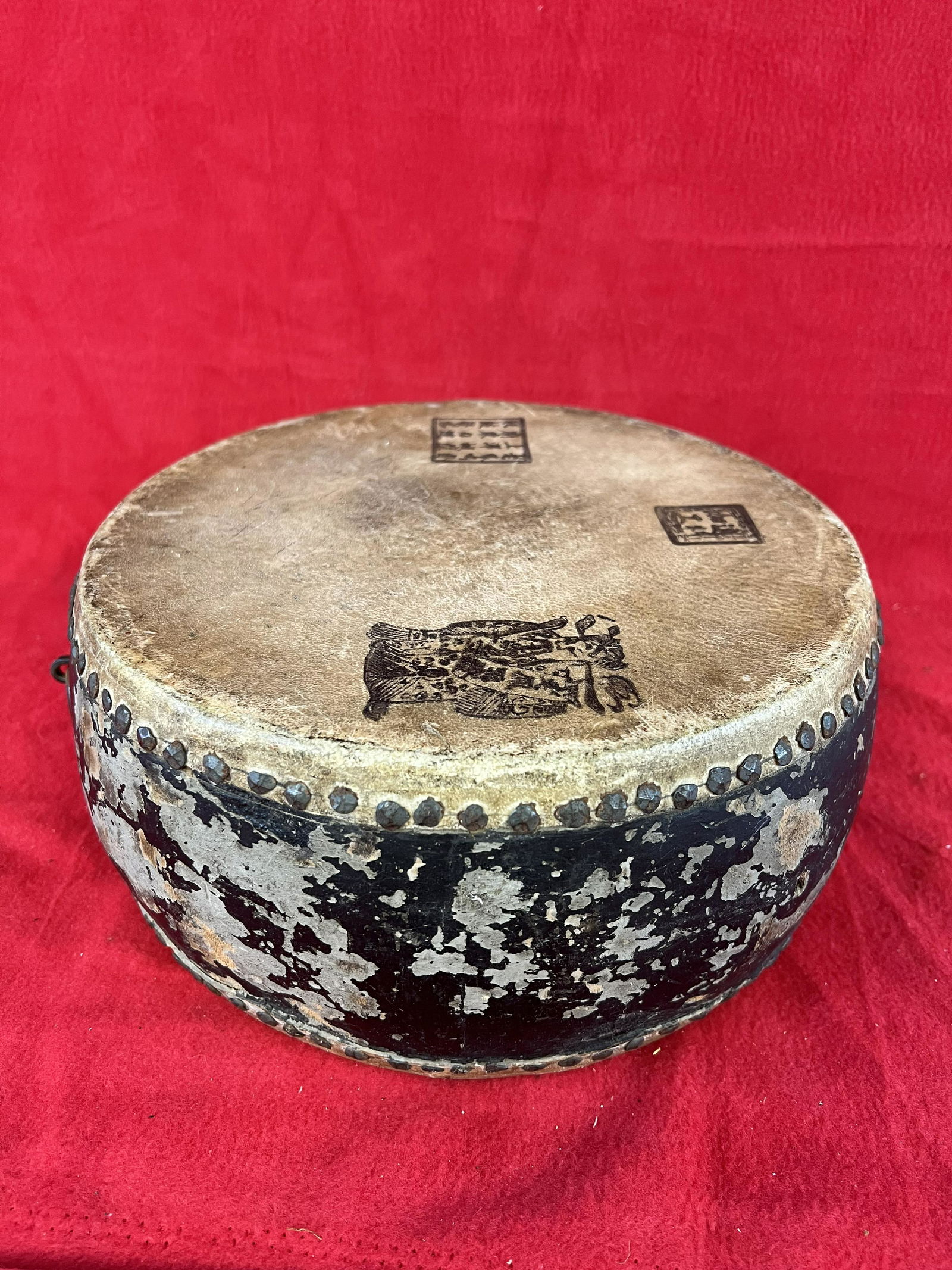Antique Asian Drum: Antique Asian Drum with hide covered drum heads, wooden body with iron fittings. The drum heads have stamped lettering and figures. Condition - some wear to paint on drum body but hide drum heads are