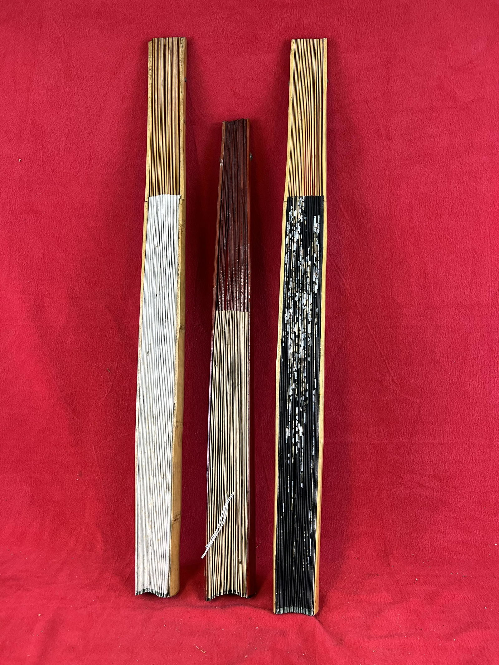 Lot of Three Asian Hand Painted Decorative Wall Fans: Lot of Three Asian Hand Painted Decorative Wall Fans the largest of which measures approximately 35" tall and all are in nice condition.