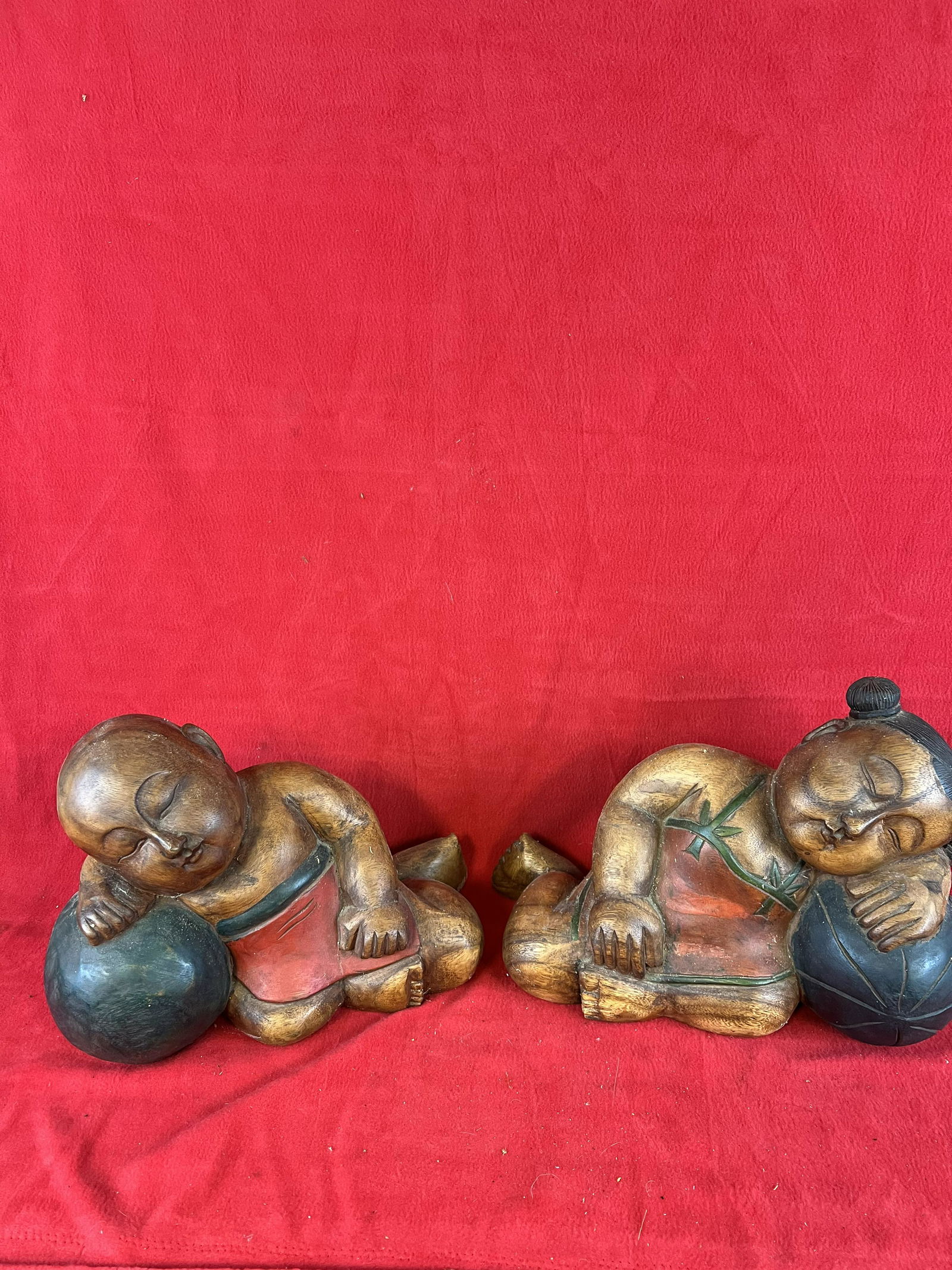 Pair of Vintage Hand Carved Wooden Figures: Pair of Vintage Hand Carved Wooden Figures depicting a recline man and woman. The figures each measure approximately 10 1/2" tall by 16" long and are in nice condition.