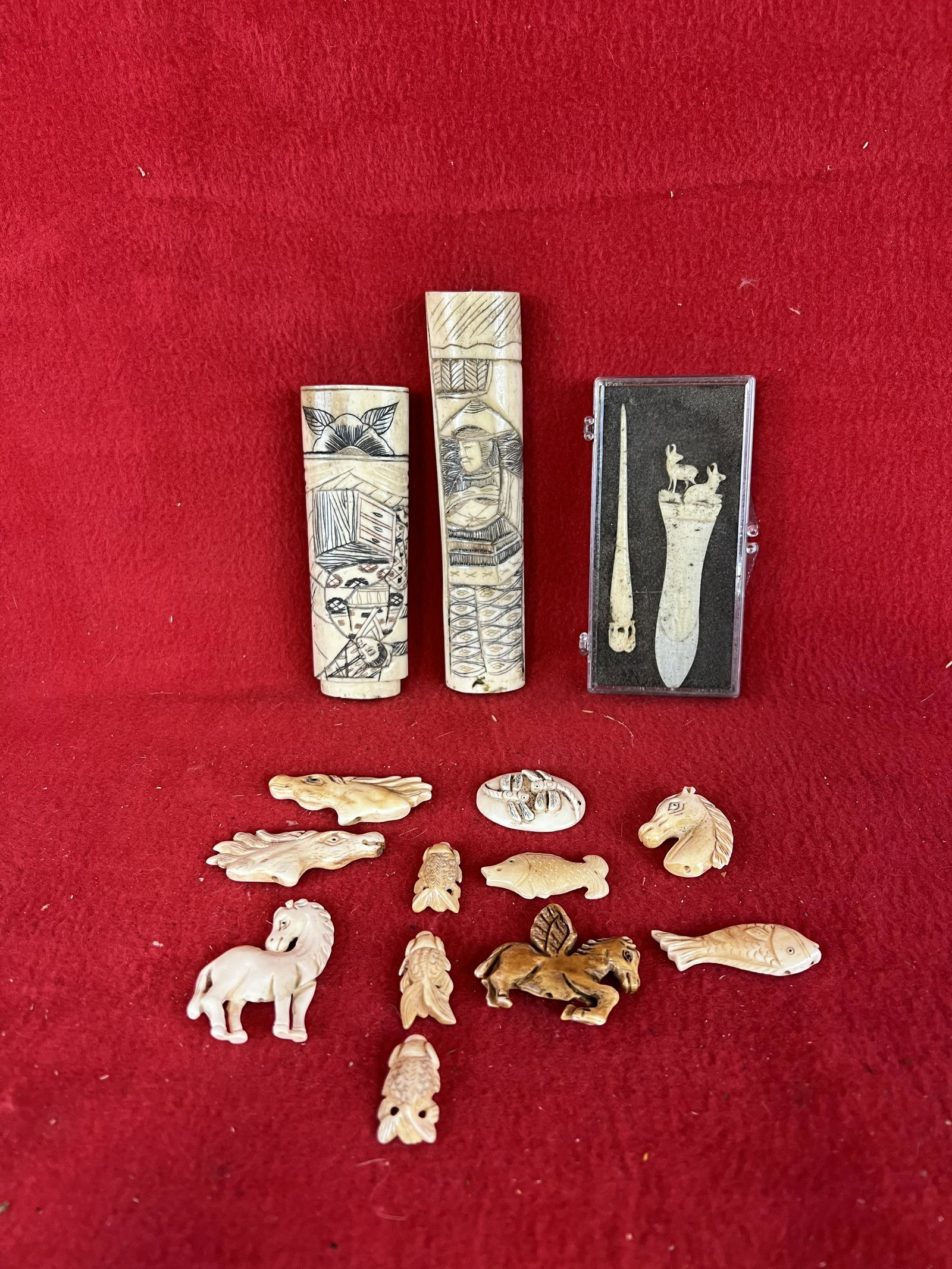 Lot of Vintage Asian Carved and Engraved Bone Items: Lot of Vintage Asian Carved and Engraved Bone Items to include knife handles and figural animals etc. The longest knife handle measures approximately 5 1/2" long. Condition - is as shown.