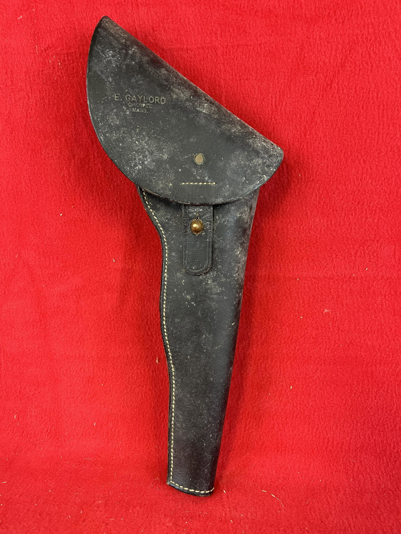 Marked E. Gaylord Chicopee Mass. Leather Gun Holster: Marked E. Gaylord Chicopee Mass. Leather Gun Holster which measures approximately 15 3/4" tall. Condition - needs a good cleaning but is otherwise fine.