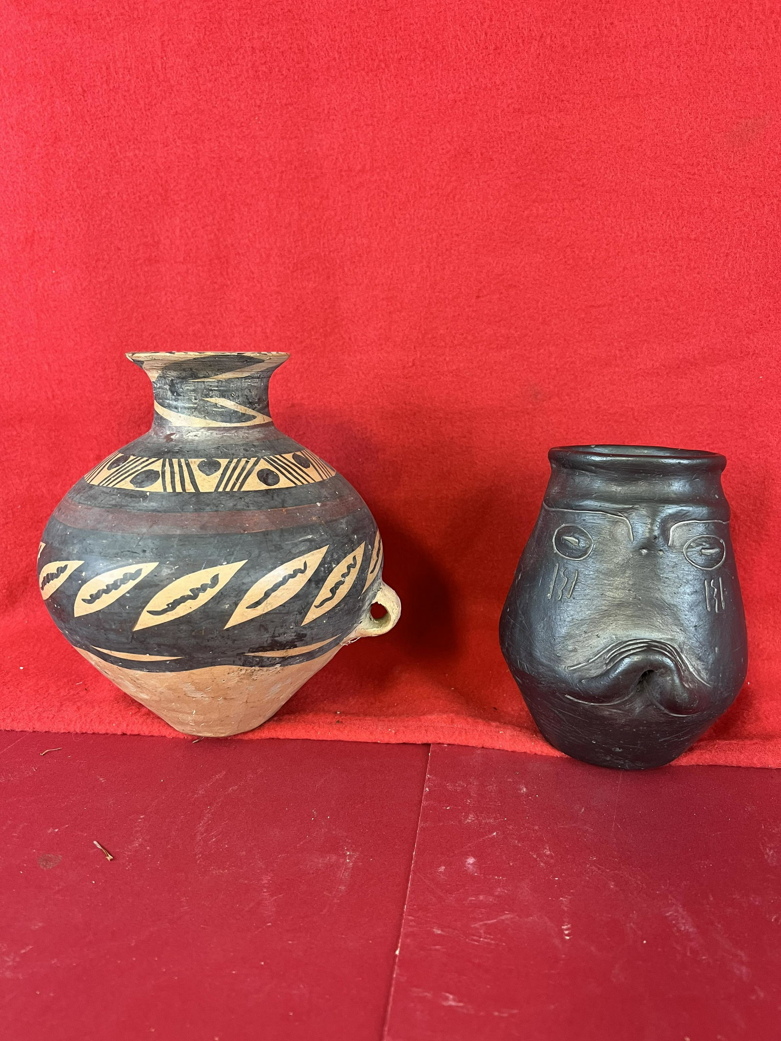 Lot Of Two Native American Pottery Vases: A Lot of Two Native American Pottery Vases One Of Which Is Blackware Done In A Anthropomorphic Style And Which Is Signed By The Artist On The Reverse. This Vase Stands Approximately 5 1/2" Tall. The S