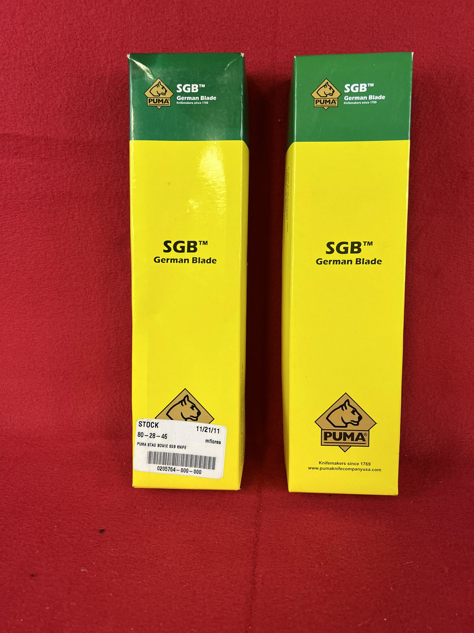 2 Puma SGB Sheath Knives: 2 Puma SGB Sheath Knives With Sheaths In Their Original Boxes. One Knife Is A 6116396 SGB Bowie With A 6 1/2" Blade And The Other Is A 6116393 SGB Skinner With A 5 1/4" Blade. Both Are Unused, Never S