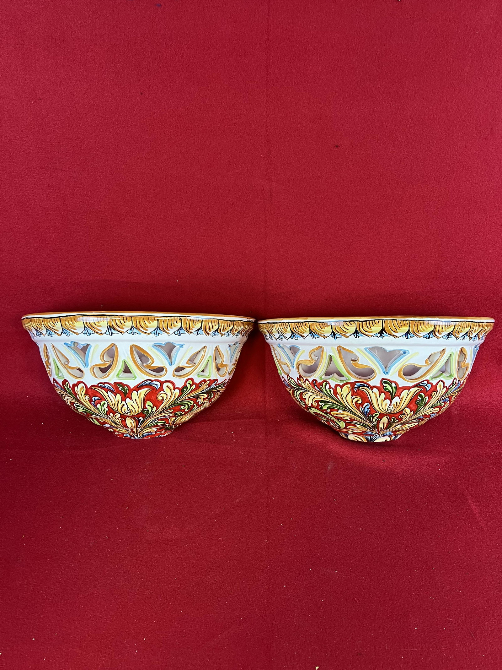 Pair Fine Capo Di Monte Wall Sconces: A fine pair of beautifully hand painted tin glazed redware Capo Di Monte (Capodimonte)style wall sconces which measure approximately 8" tall by 14" wide and extend 7 3/4 " from the wall. Condition - e