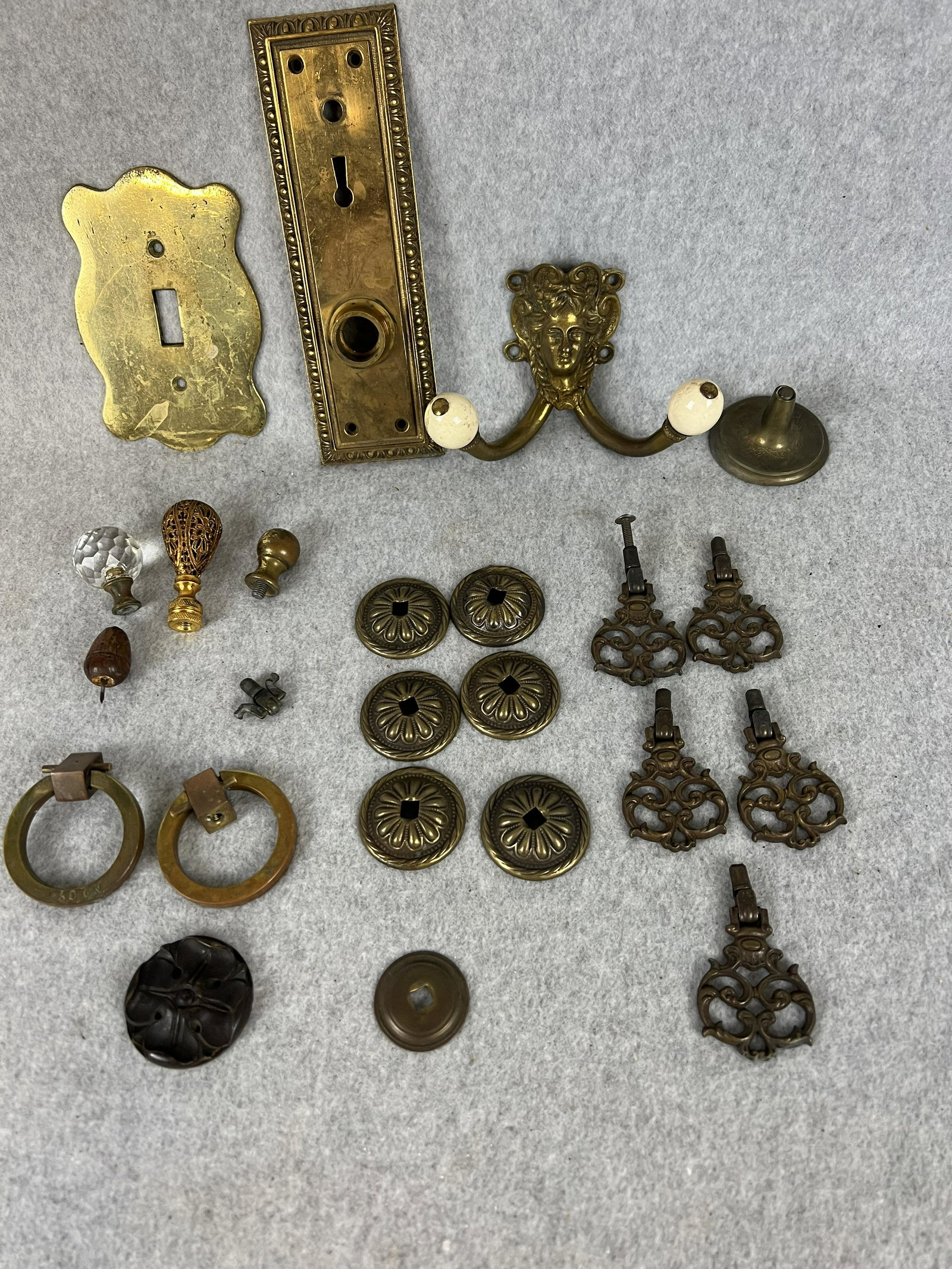 Lot Vintage Furniture Hardware Etc.: Lot of vintage furniture hardware to include pulls, hook, door plate and a couple lamp finials.