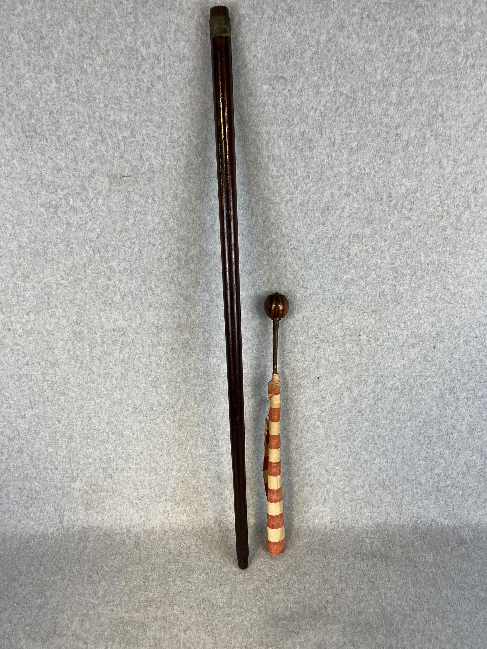Antique Patriotic Cane Containing 42 Star US Flag (Unofficial 1889): Patriotic cane / walking stick which has a removable top which reveals a 42 star (unofficial 1889) 12" by 15" United States Flag. Cane measures approximately 36" long with a wooden shaft. Condition -
