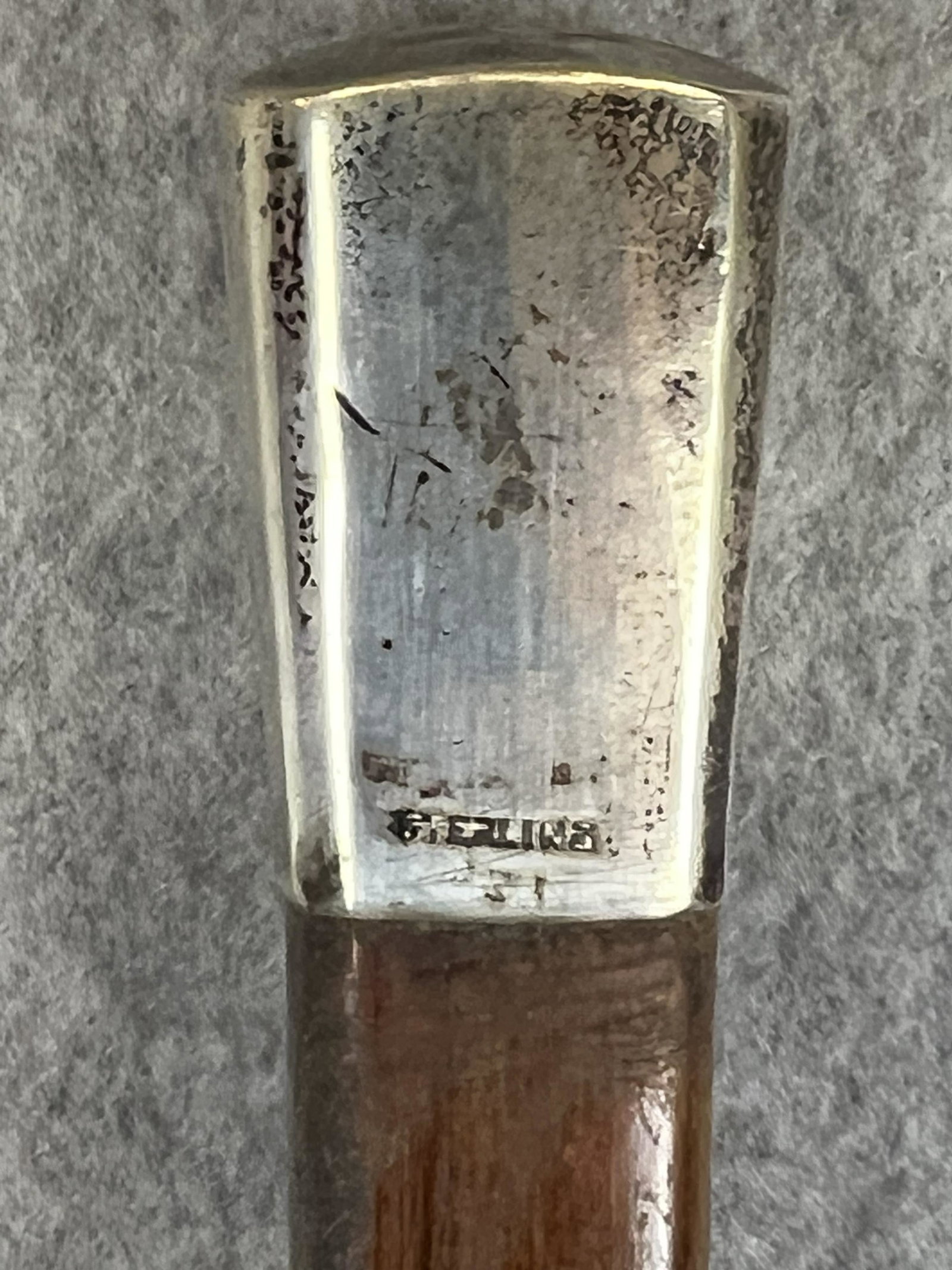 Antique Sterling Silver Top Cane: Antique cane / walking stick with a marked sterling silver handle on a square shaped wooden shaft. Cane measures approximately 35" long and is in fine condition.