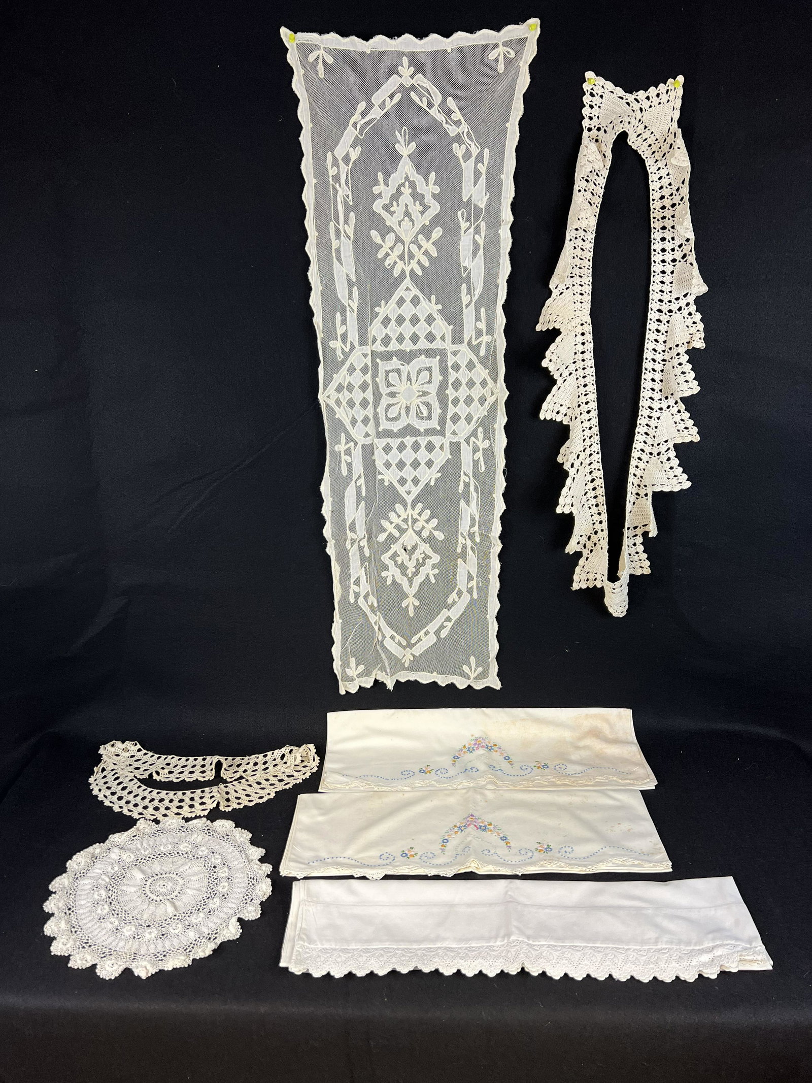 Victorian Linen Lot: Victorian Linen Lot of white-work consisting of1 pillow sham; 4 pillow cases with either initials or embroidery; 1 open work small table cloth, 1 doily and 1 piece of crochet lace edging.
