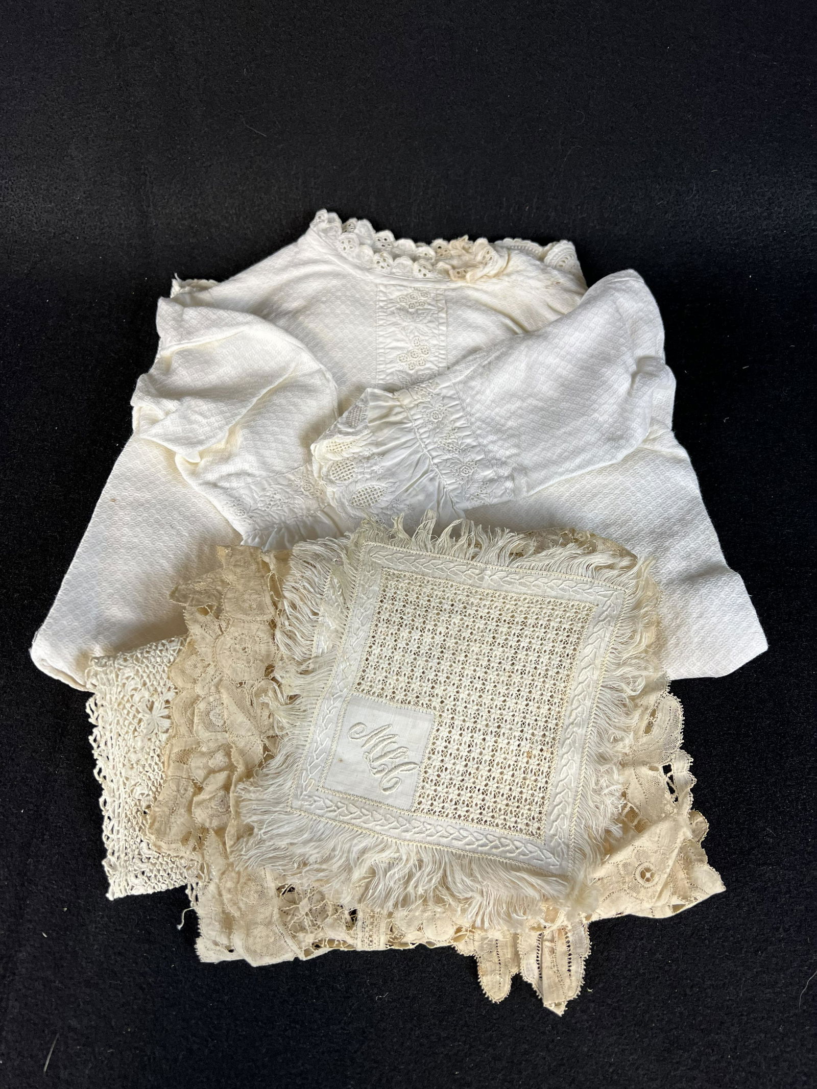 Victorian Lace and Linen Lot: Victorian Lace and Linen Lot consisting of 2 small square doilies with embroidered initials; 1 Irish Crochet doily with embroidered linen inserts; 1 fine lace shawl and 1 baby christening gown - embro