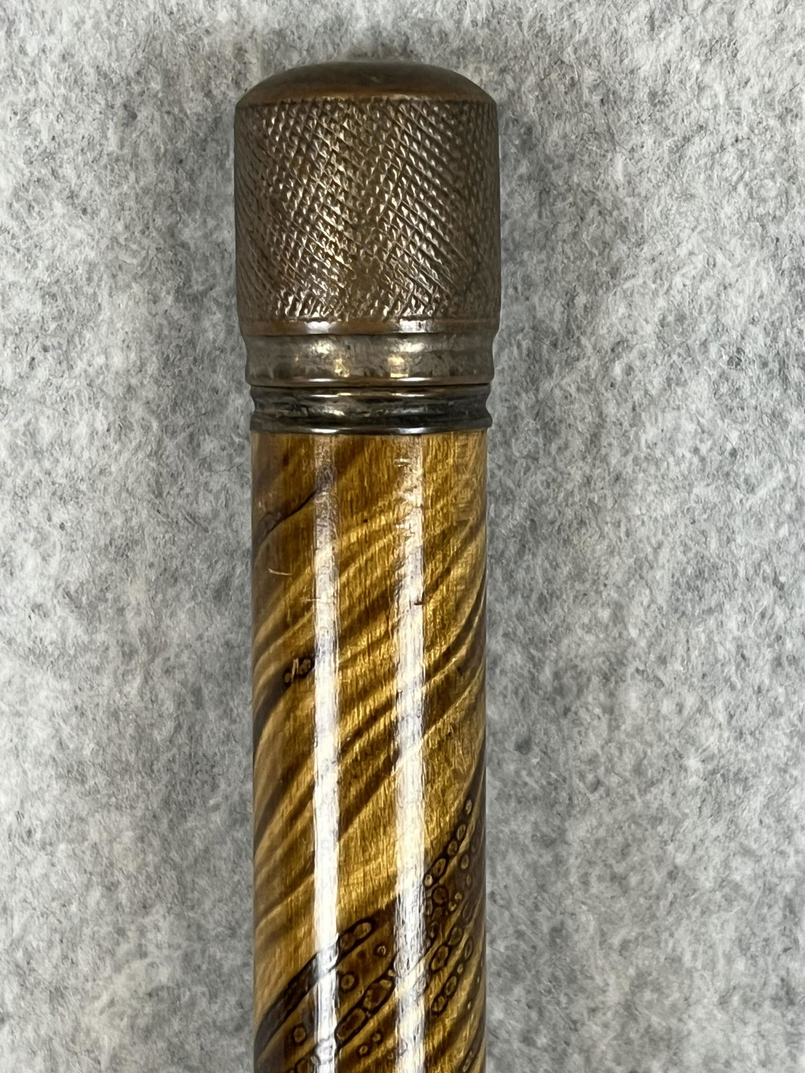 Antique Gadget Cane With Fountain Pen: Antique cane / walking stick which is a gadget cane as it can be taken apart to reveal a fountain pen. The cane / walking stick has a wooden shaft which has been grain painted to resemble exotic wood