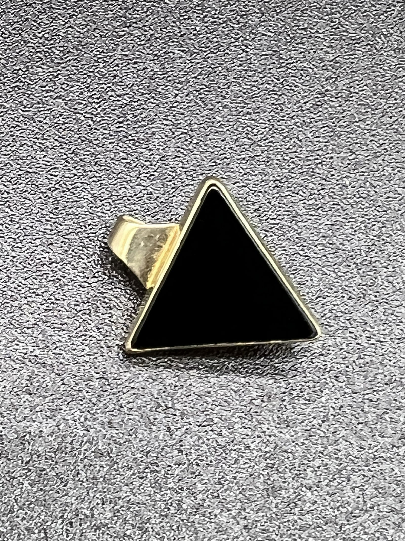 Ed Levin 14K Gold Slide / Pendant Set With Black Onyx: A signed Ed Levin 14K gold slide / pendant which is set with black onyx and has a weight of 1.5 dwts. Condition - fine.