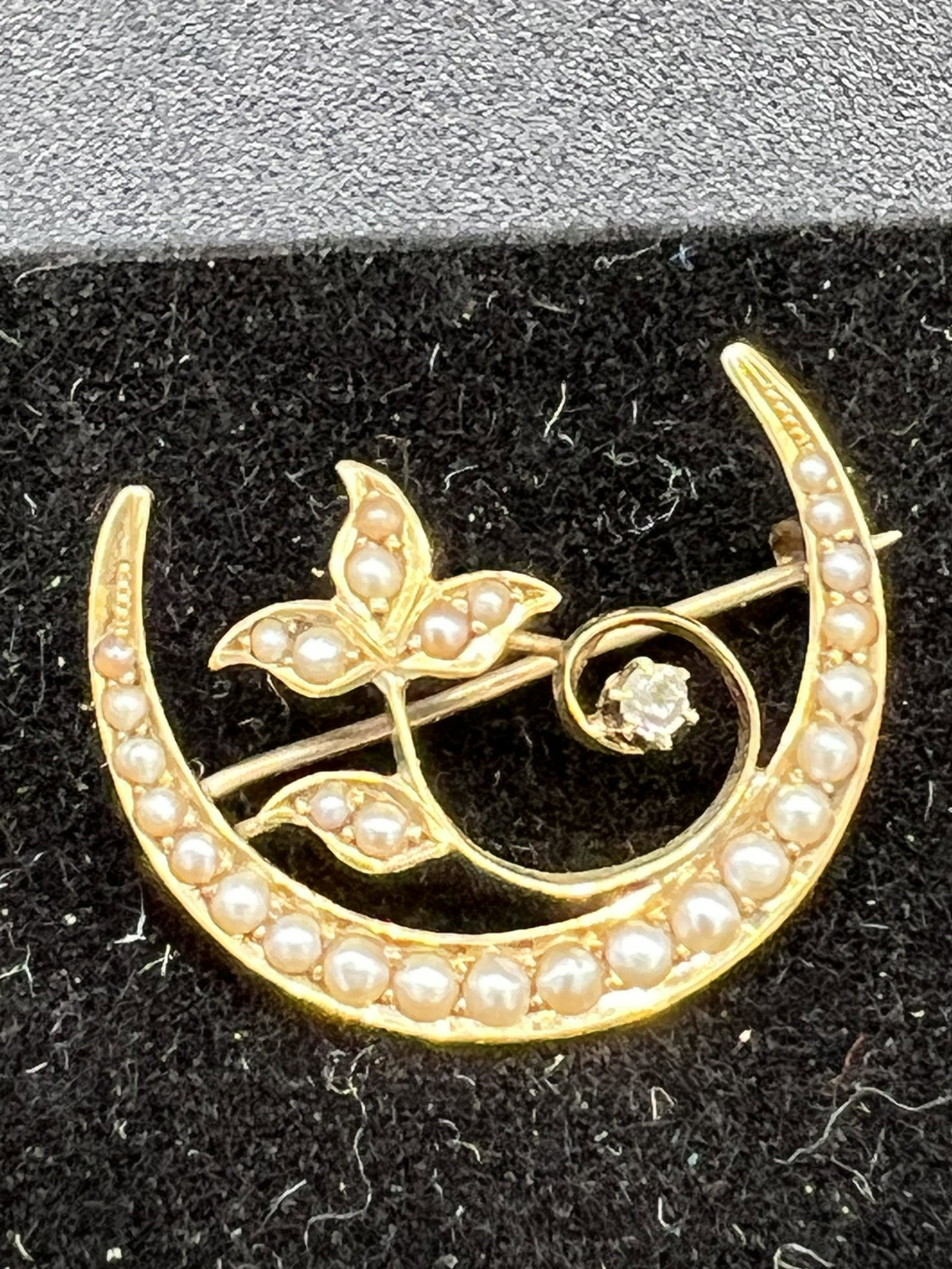 Antique 14K Gold Crescent Shaped Pin / Brooch Set With Pearls: Antique 14K gold crescent shaped pin set with seed pearls along with a small stone (diamond?) and which has a weight of 1.5 dwts. Condition - fine.