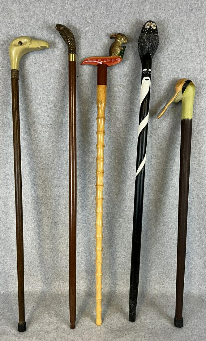 Lot 5 Animal & Bird Theme Canes: Lot of five animal and bird theme canes to include a carved and painted wooden cane with the handle in the form of a owl, two canes with carved and painted wooden handle in the form of birds, a cane w