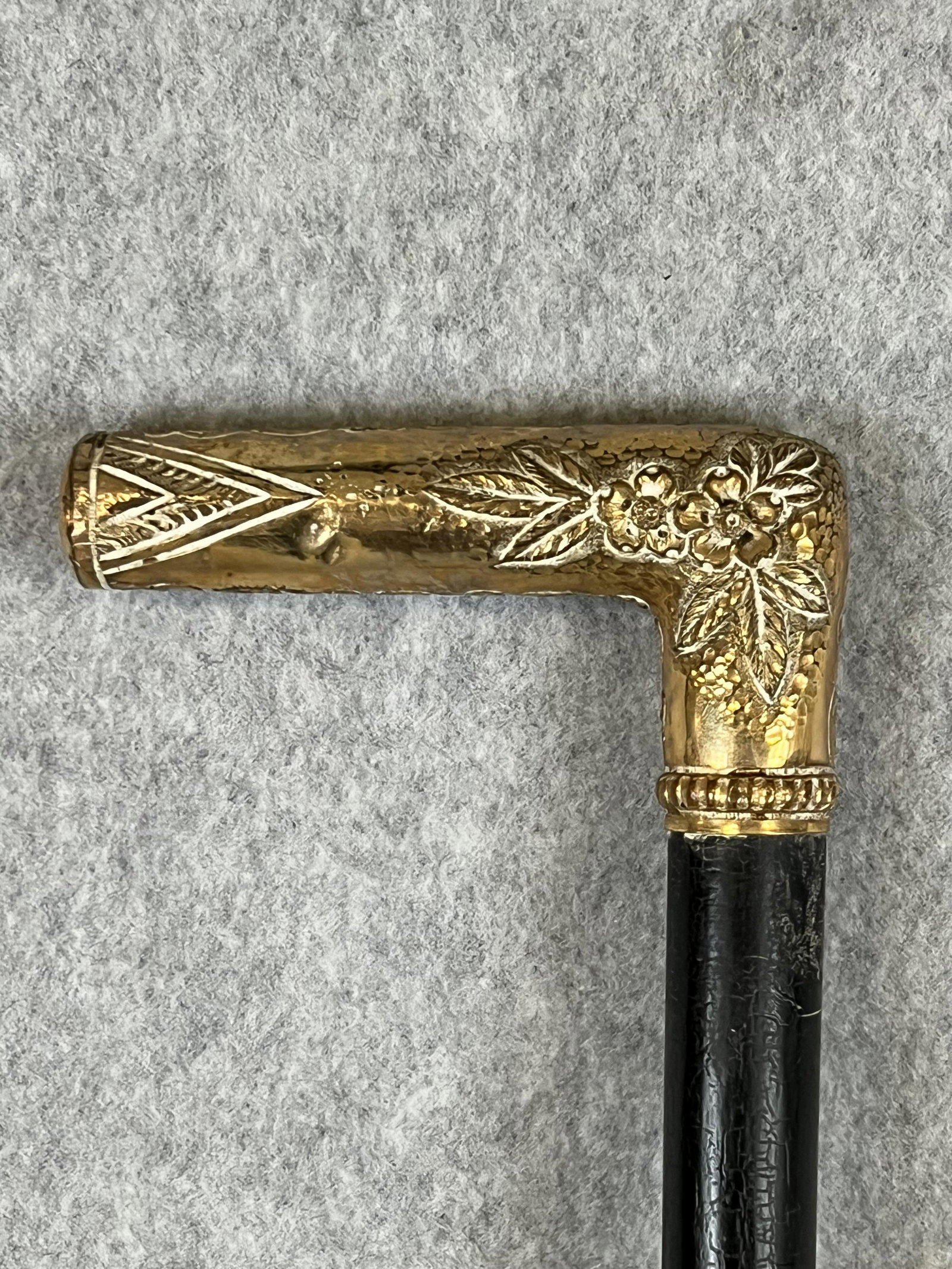 Antique Gold Headed Cane Dated 1891: Antique ornate gold headed cane which has the name B. F, Callender engraved on the head which measures approximately 1 1/2" tall and is 3 1/8" wide and is in a ebonized wood shaft. Condition - one sma