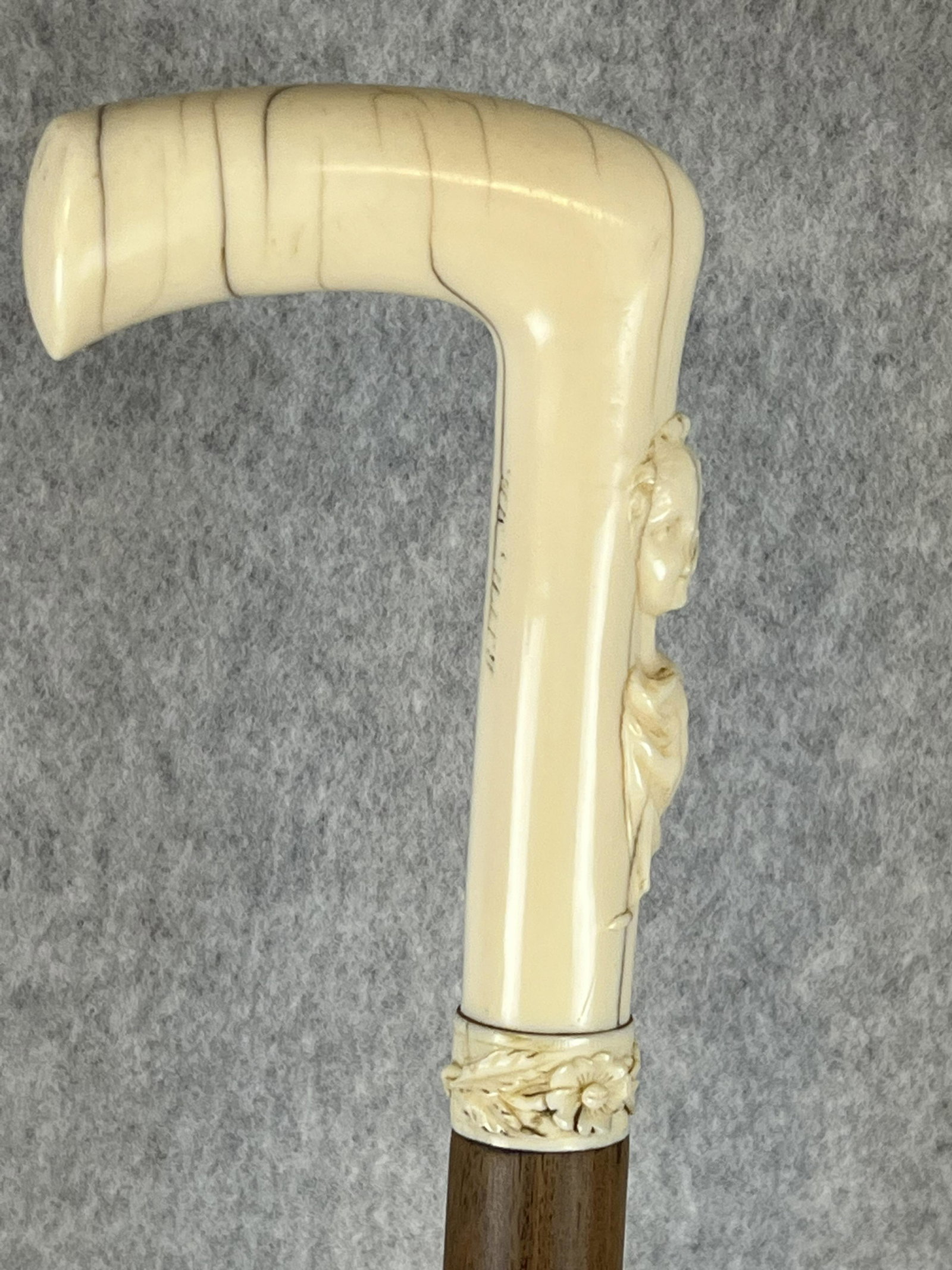 Antique Carved Bone Handled Cane: Antique Carved bone handled cane / walking stick with a finely carved depiction of a young woman in the bone segment just below the top handle. The back of this segment has the inscription Arthur Sewi