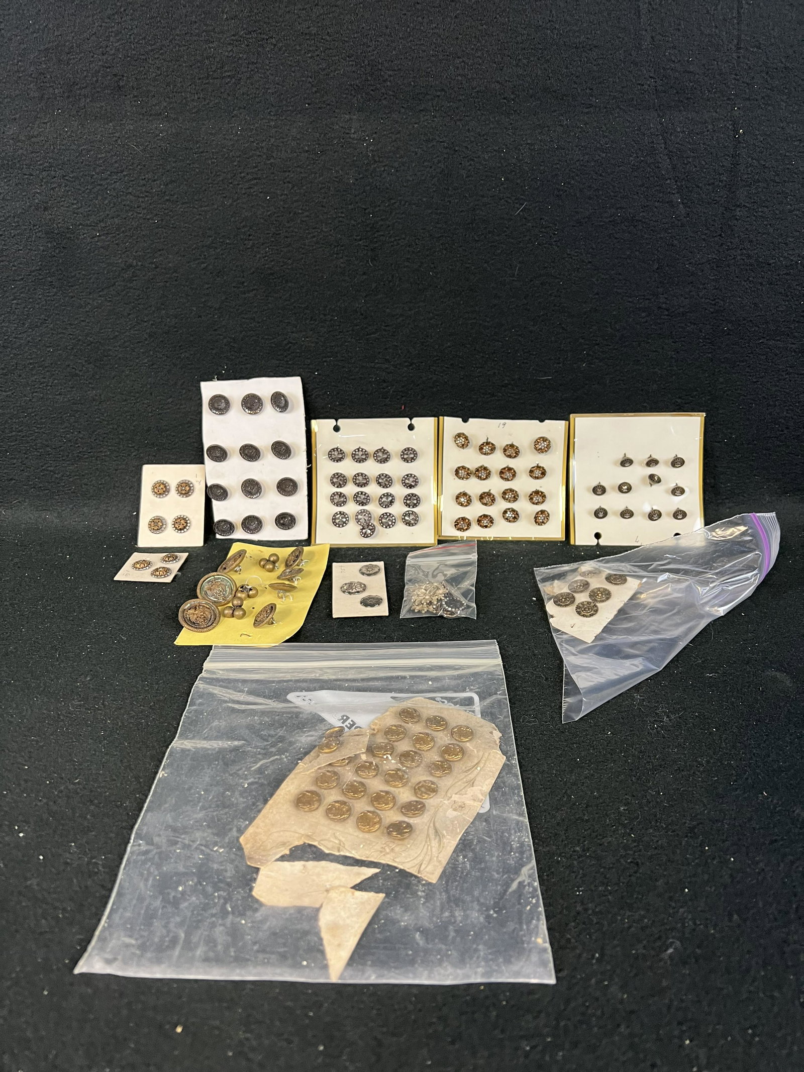 Large Lot Antique Metal Buttons: A large lot of antique buttons made of metal many of which are mounted on cards and are in fine condition.