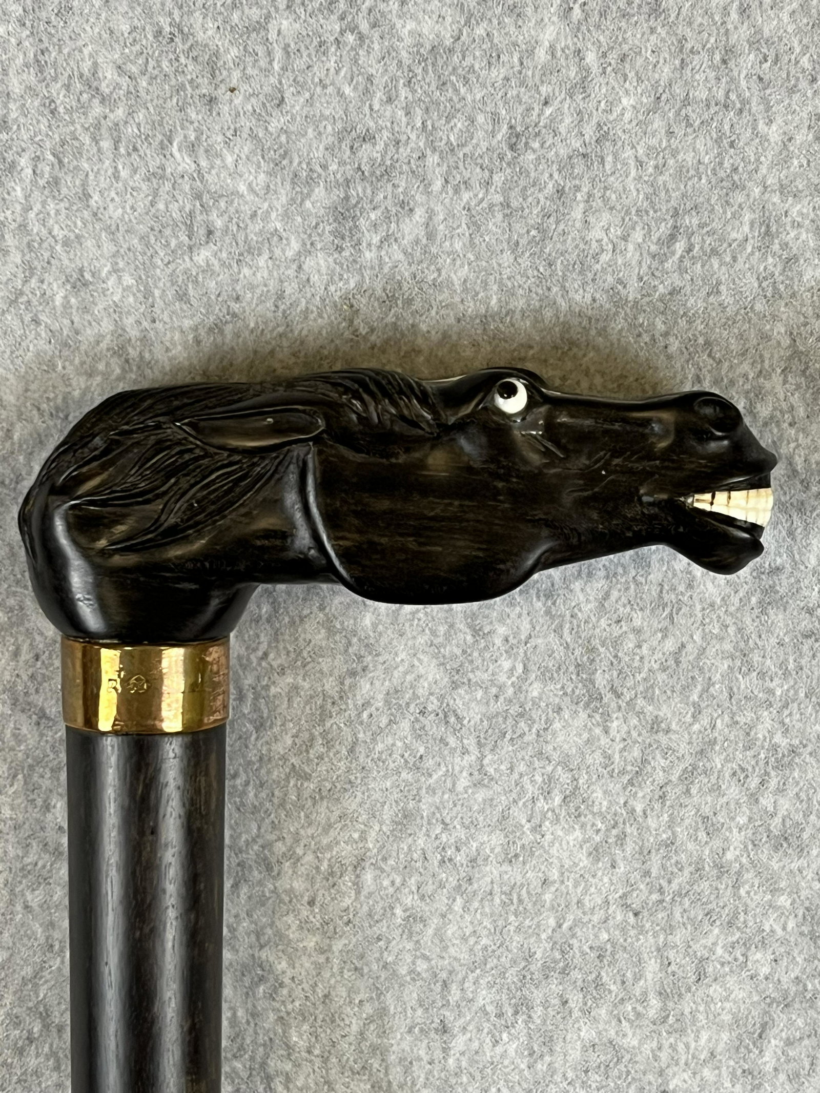 Antique Horse Head Handled Cane / Walking Stick: Exceptional antique cane / walking stick which features a hand carved exotic wood (ebony?)handle in the form of a horses head with inlaid bone teeth, eyes and diamond shaped accent on top of head. The