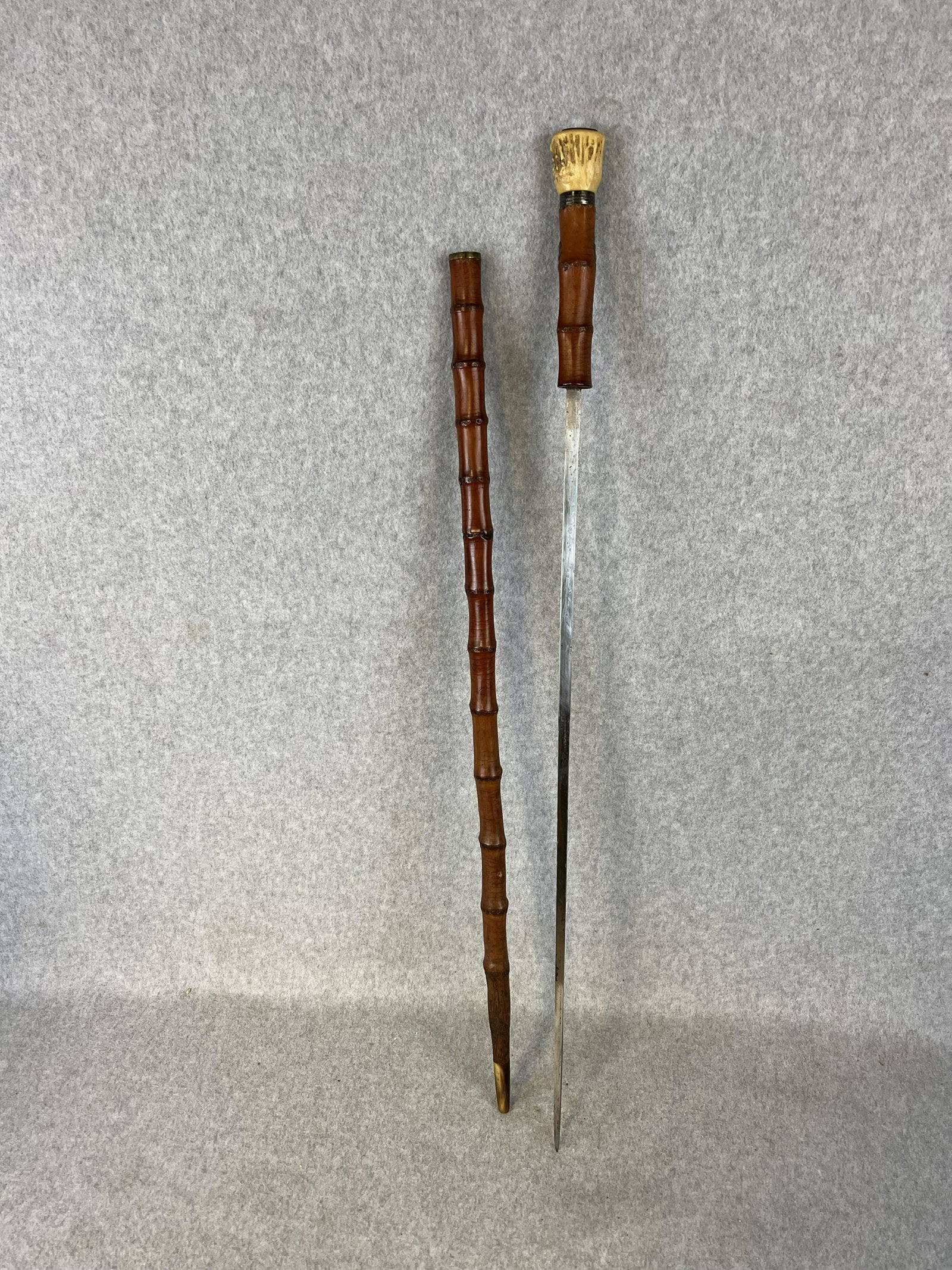 Antique Dated 1820 Sword Cane / Walking Stick with Antler Handle: Antique dated 1820 sword cane / walking stick with a antler handle topped with a silver plate which has the date 1820 stamped into it. The cane has a silver collar and has silver eyelets on a bamboo s