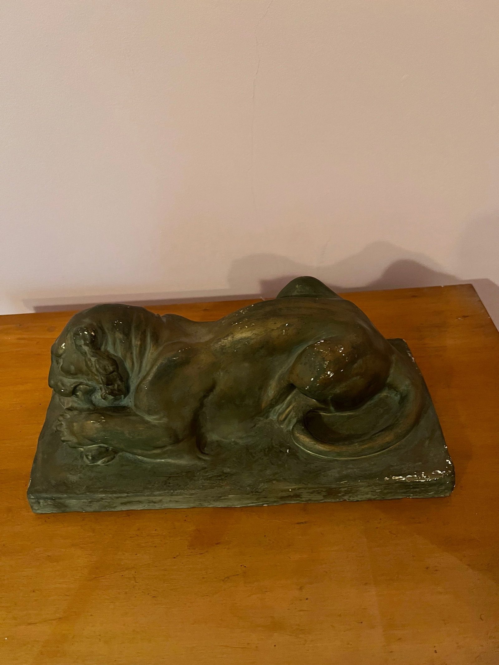 Victorian Plaster Figurine Of A Lion: Victorian Plastermantle Figurine in the form of a reclining lion which measures approximately 13" in length. Condition - some wear to what appears to be its original painted surface otherwise fine.