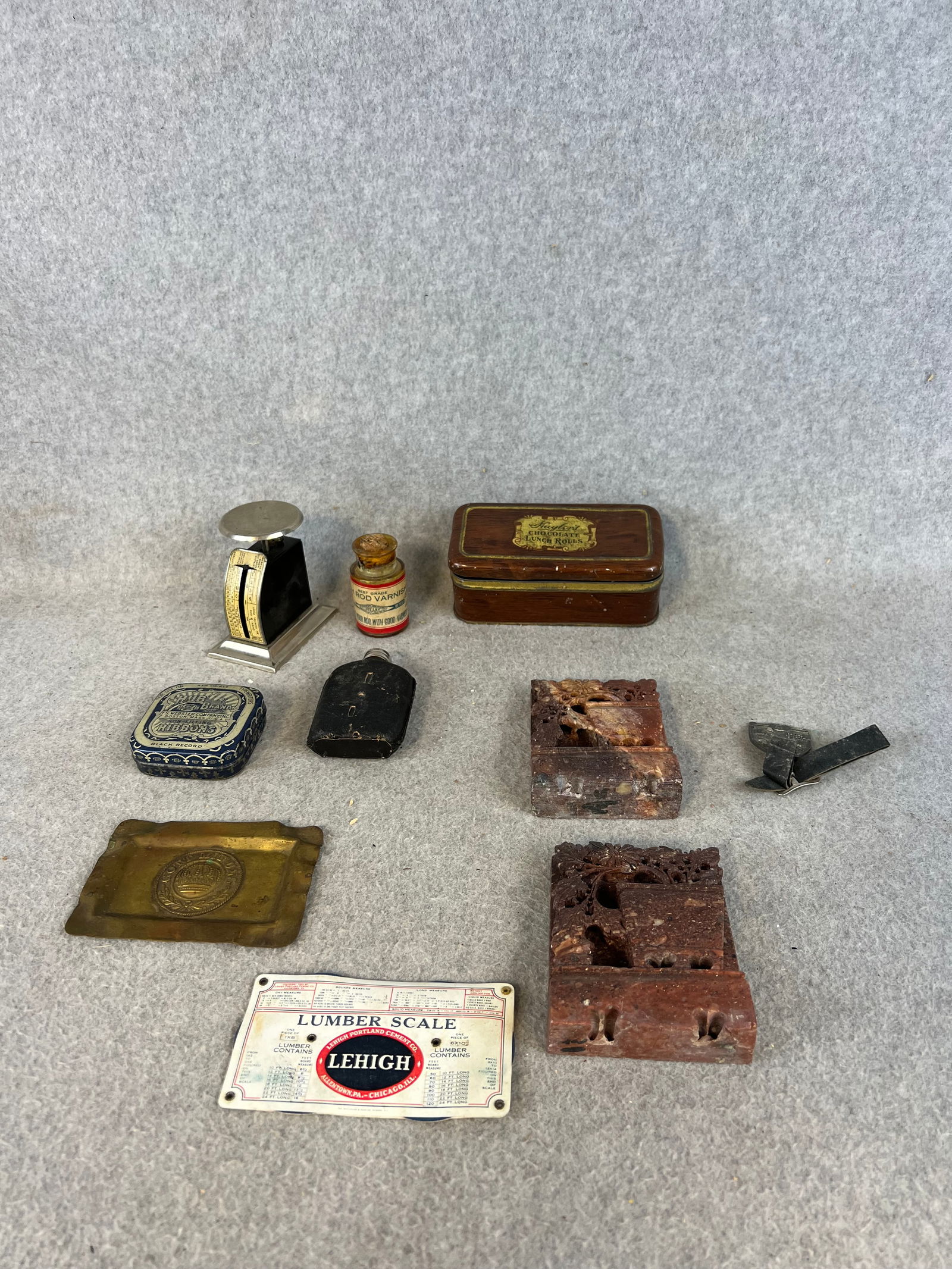 Lot Misc. Antique Items: Lot of misc. antique items to include: Lorain Cranes watch fob, pair carved soapstone bookends, Myers letter scale, celluloid Lehigh Lumber scale, wax seal, miniature leather covered glass whiskey nip