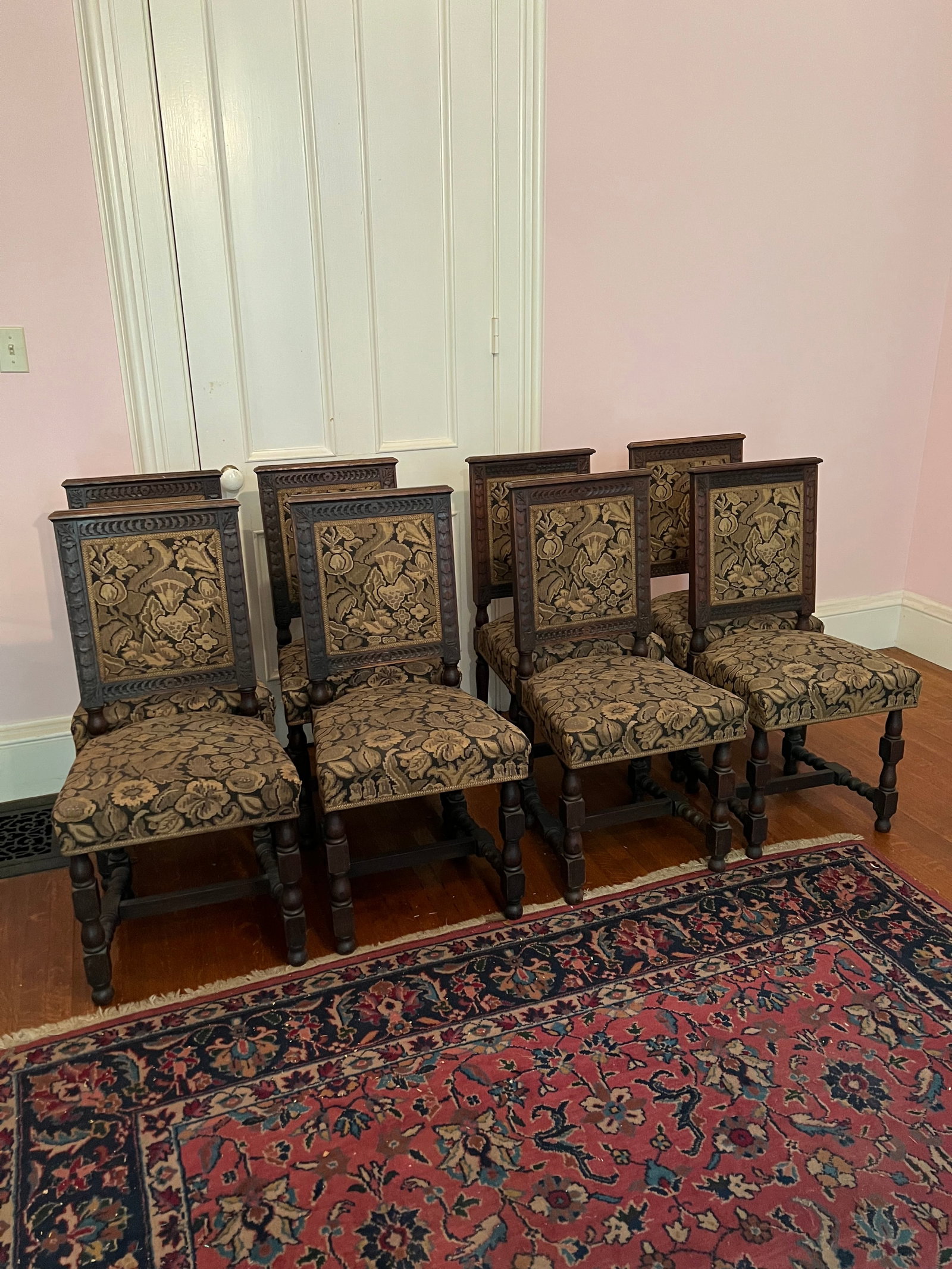Set of 8 Carved Decorated Oak Chairs: Set of 8 Carved Decorated Oak Chairs, stretcher base with seat and back of chair with upholstered fabric. Good condition. Each chairs measures approximately 17.75" W x 18" D x 36" H.