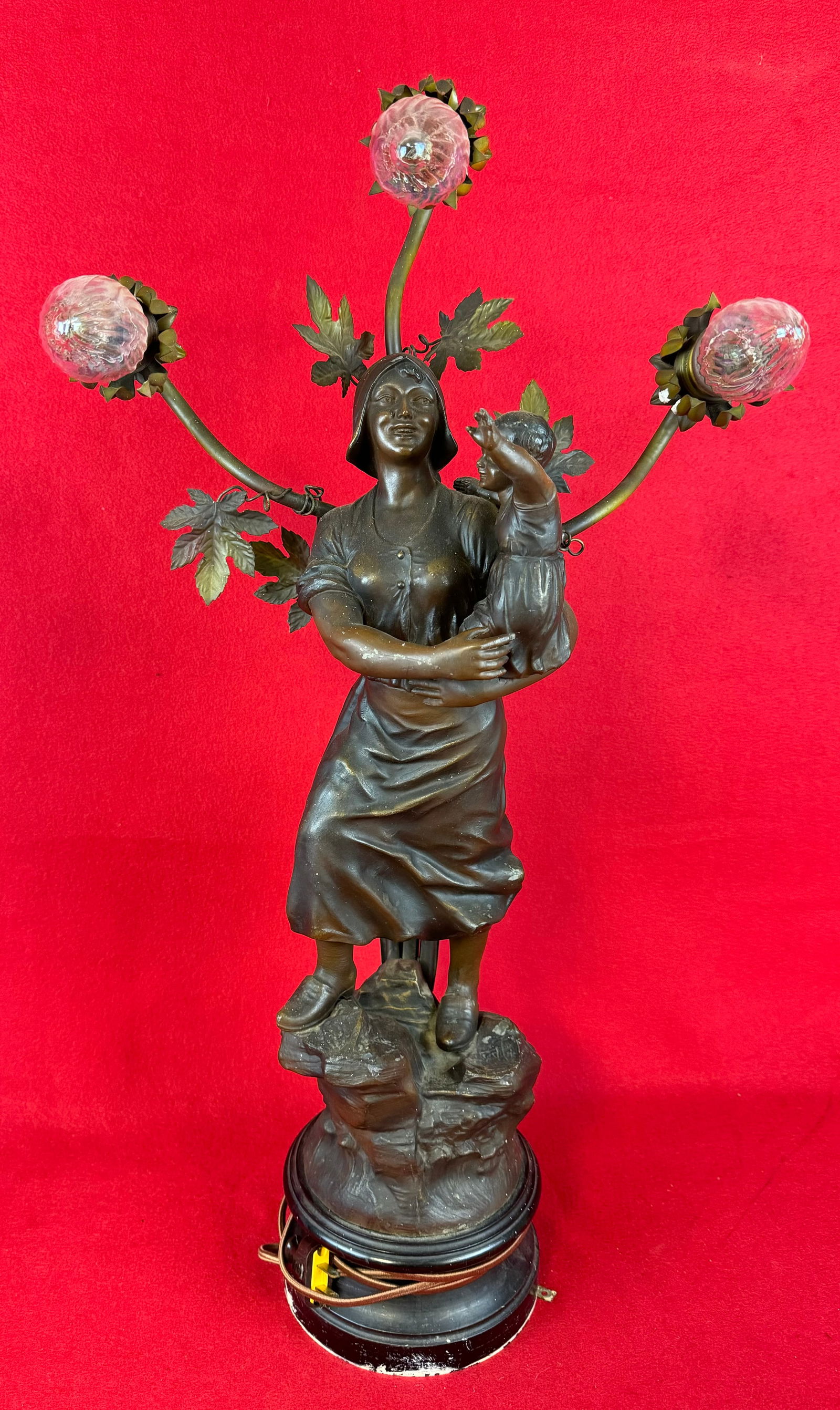 Antique Victorian Figural Newel Post Light: Ornate antique Victorian figural newel post light in the form of a pheasant woman holding a child with Art Nouveau inspired floral buds above each of which holds a light bulb. Figural lamp measures ap