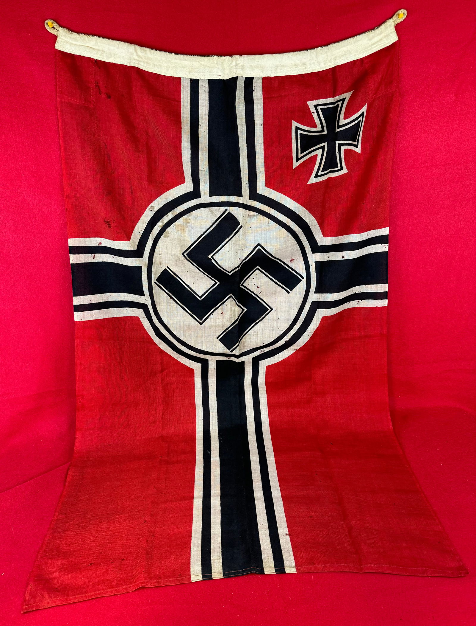 WW2 German Kreigsmarine Naval Flag: World War Two German Kreigsmarine flag which measures approximately 51" by 32" and is marked Reichskriegs Flag at edge. Flag is in nice condition with just a couple small minor holes as shown.